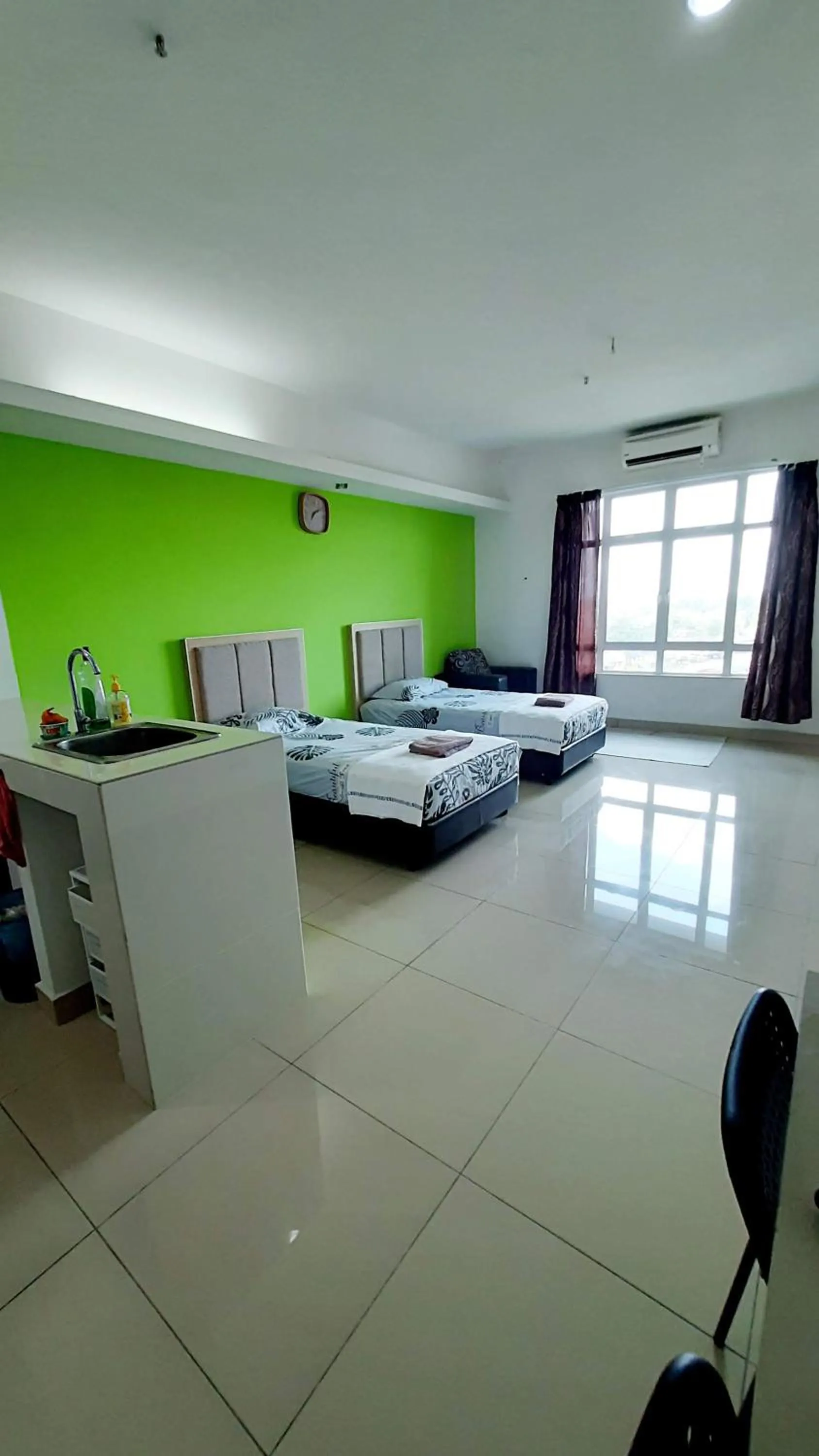 Bed in De Viana Apartments Homestay