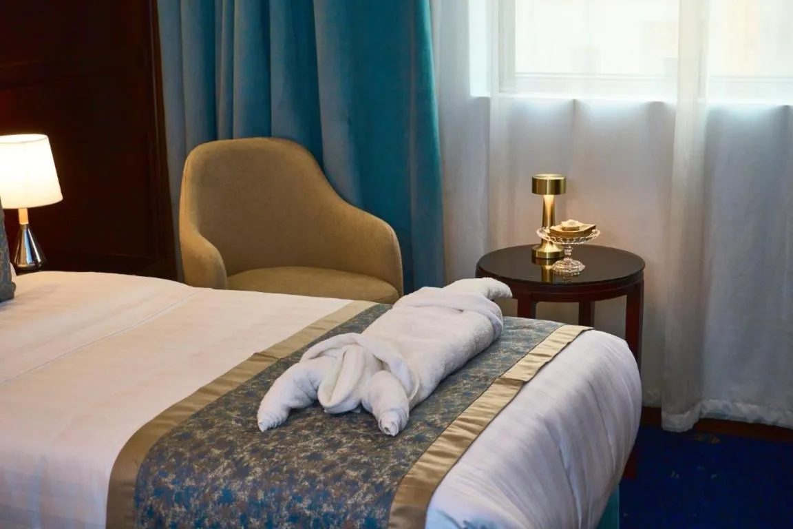 Photo of the whole room, Bed in Selat Al Bait Hotel