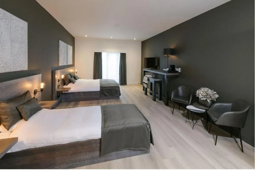 Bed in Hotel De Rustende Jager