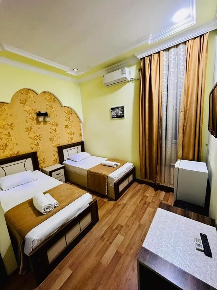 Bed in Lux Palace Hotel