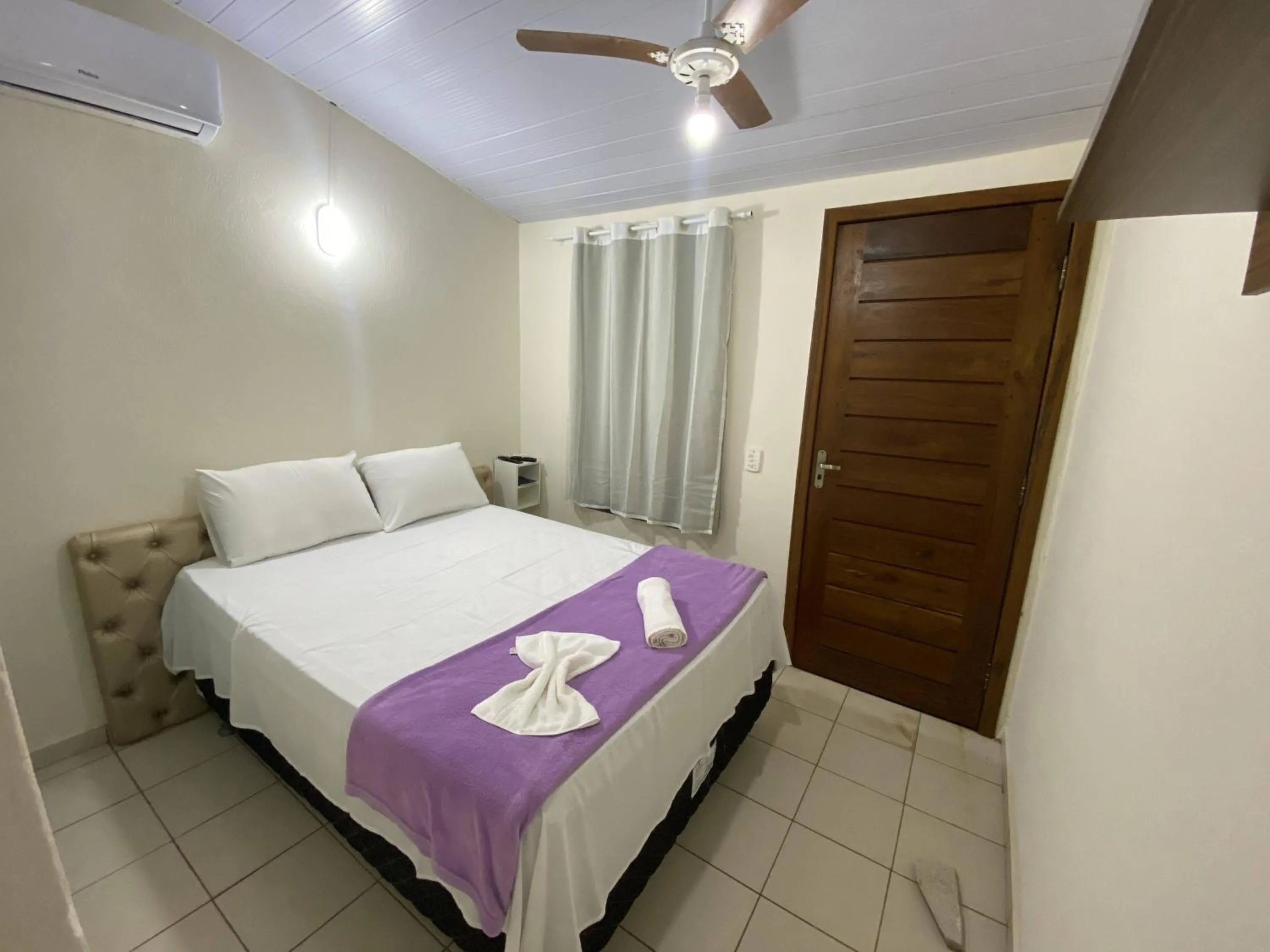 Bed in Pousada Rubbi Violeta