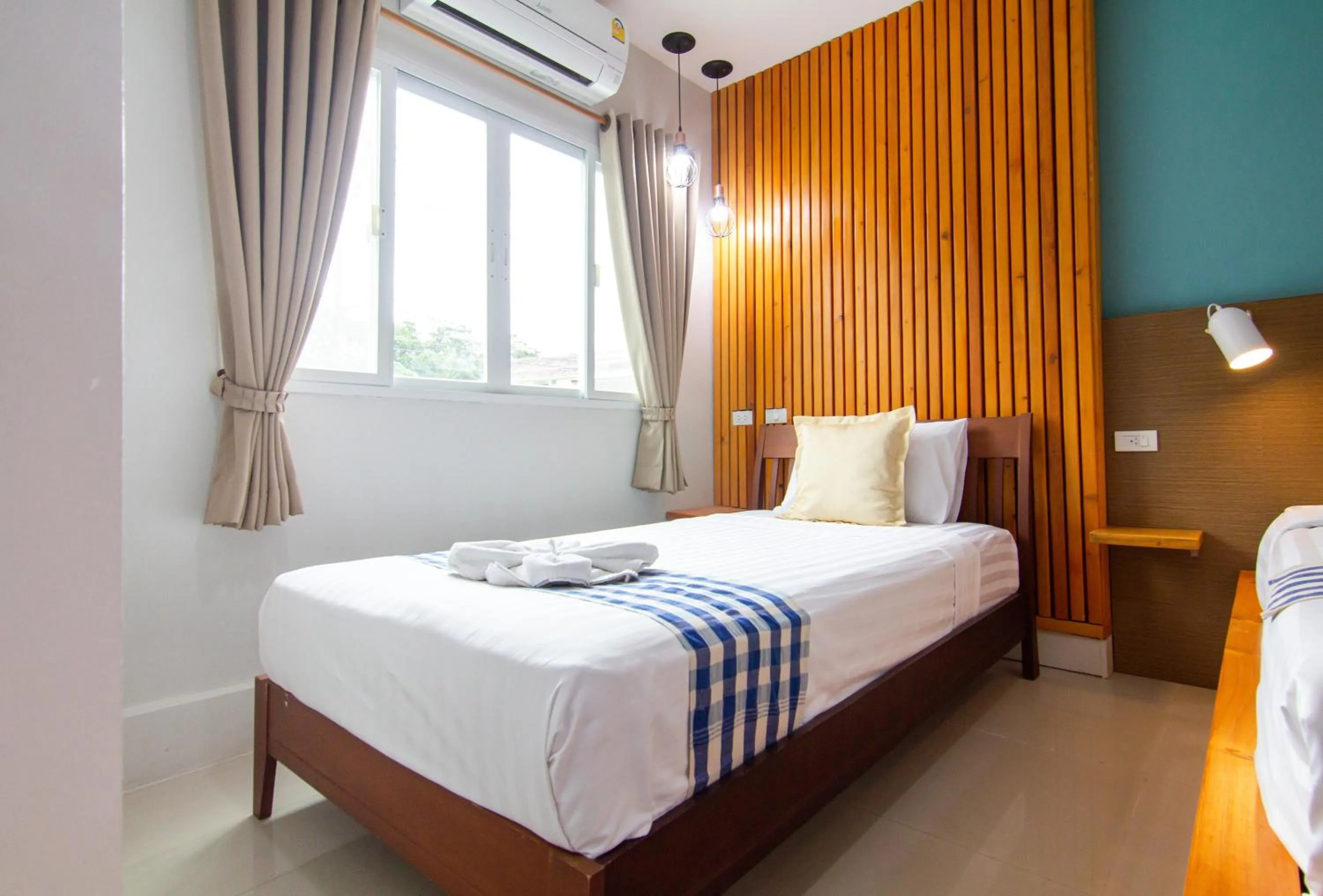 Bed in Kamala Beach Residence