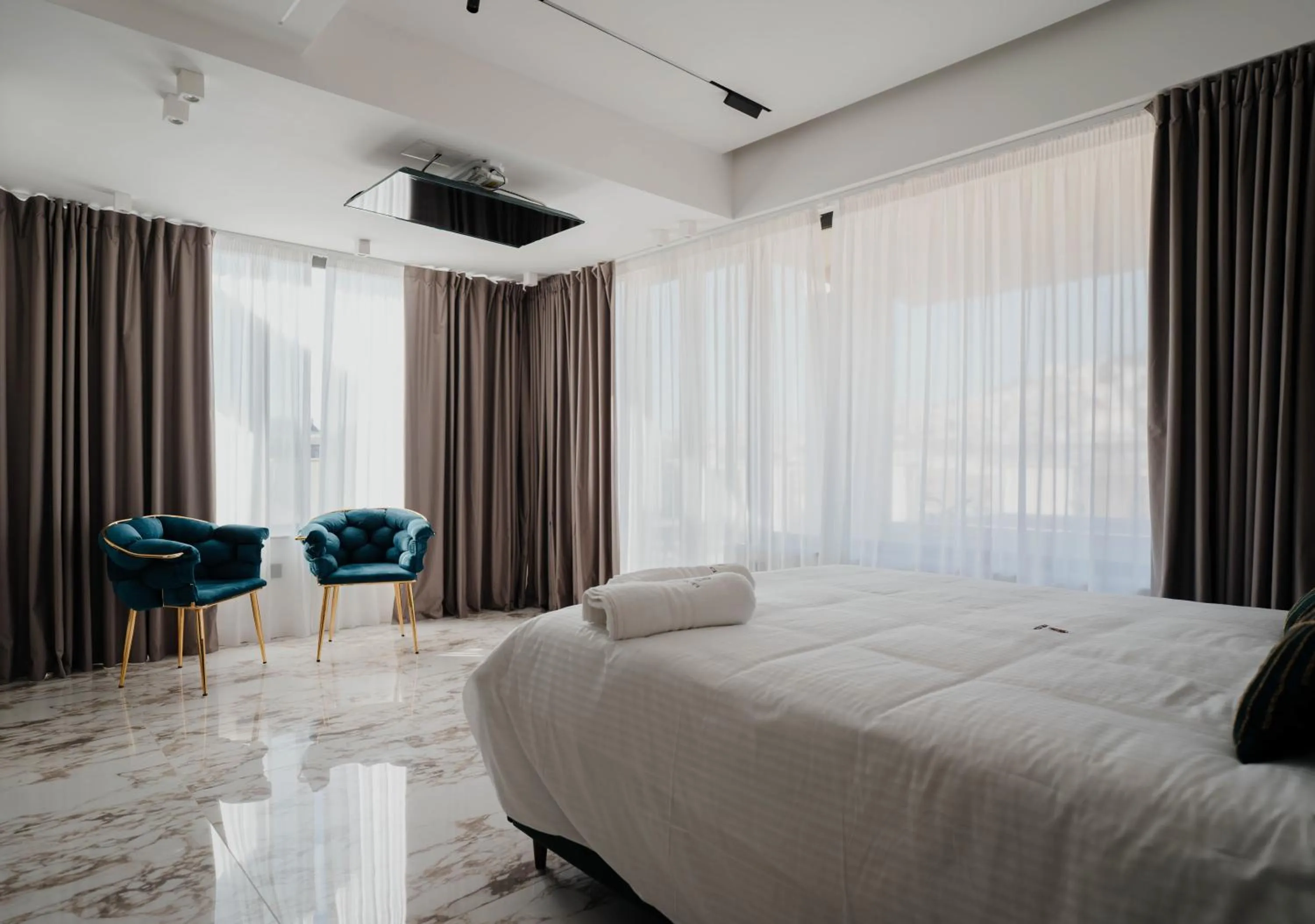 Bed in POETICA BOUTIQUE SKY HOTEL