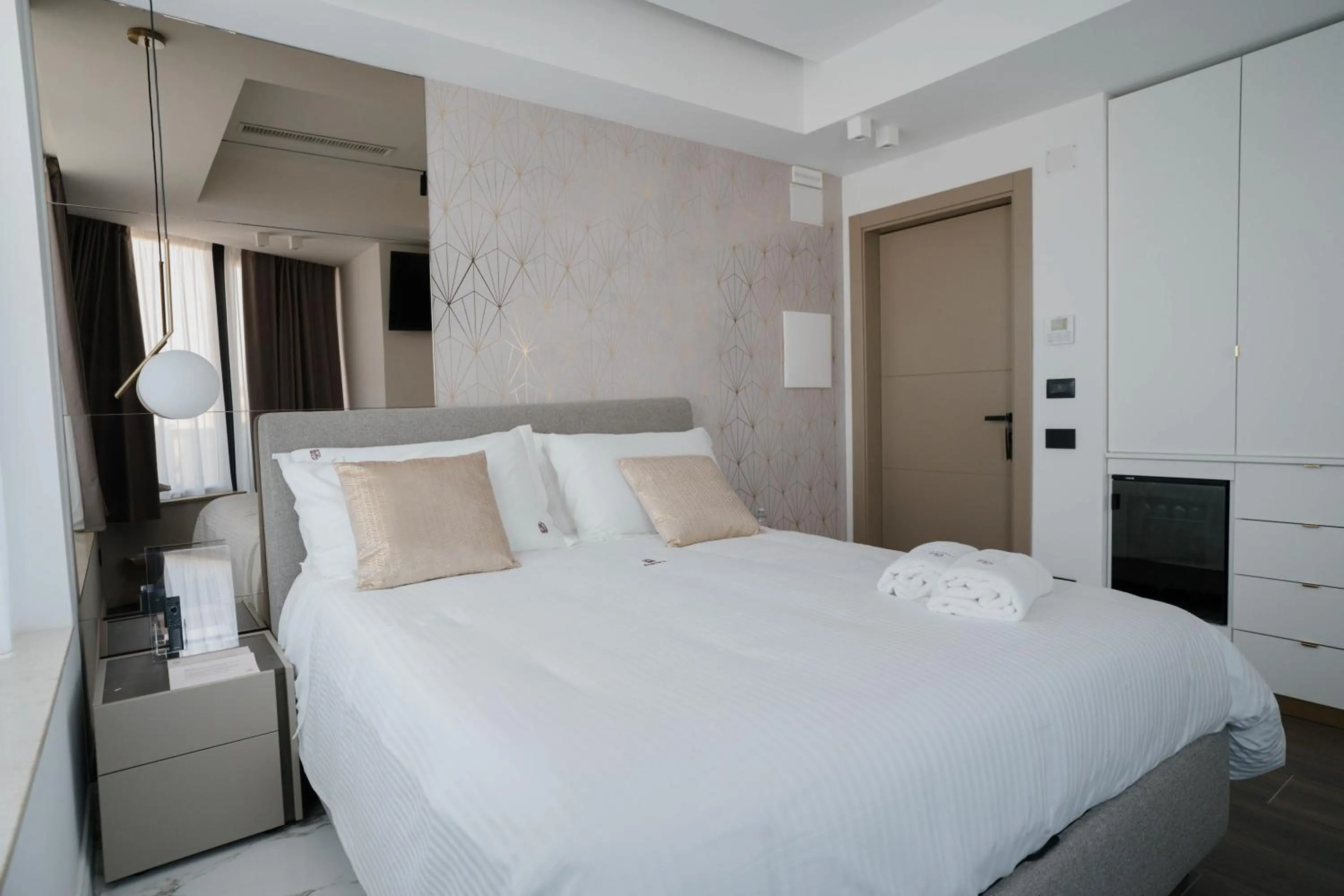 Bed in POETICA BOUTIQUE SKY HOTEL