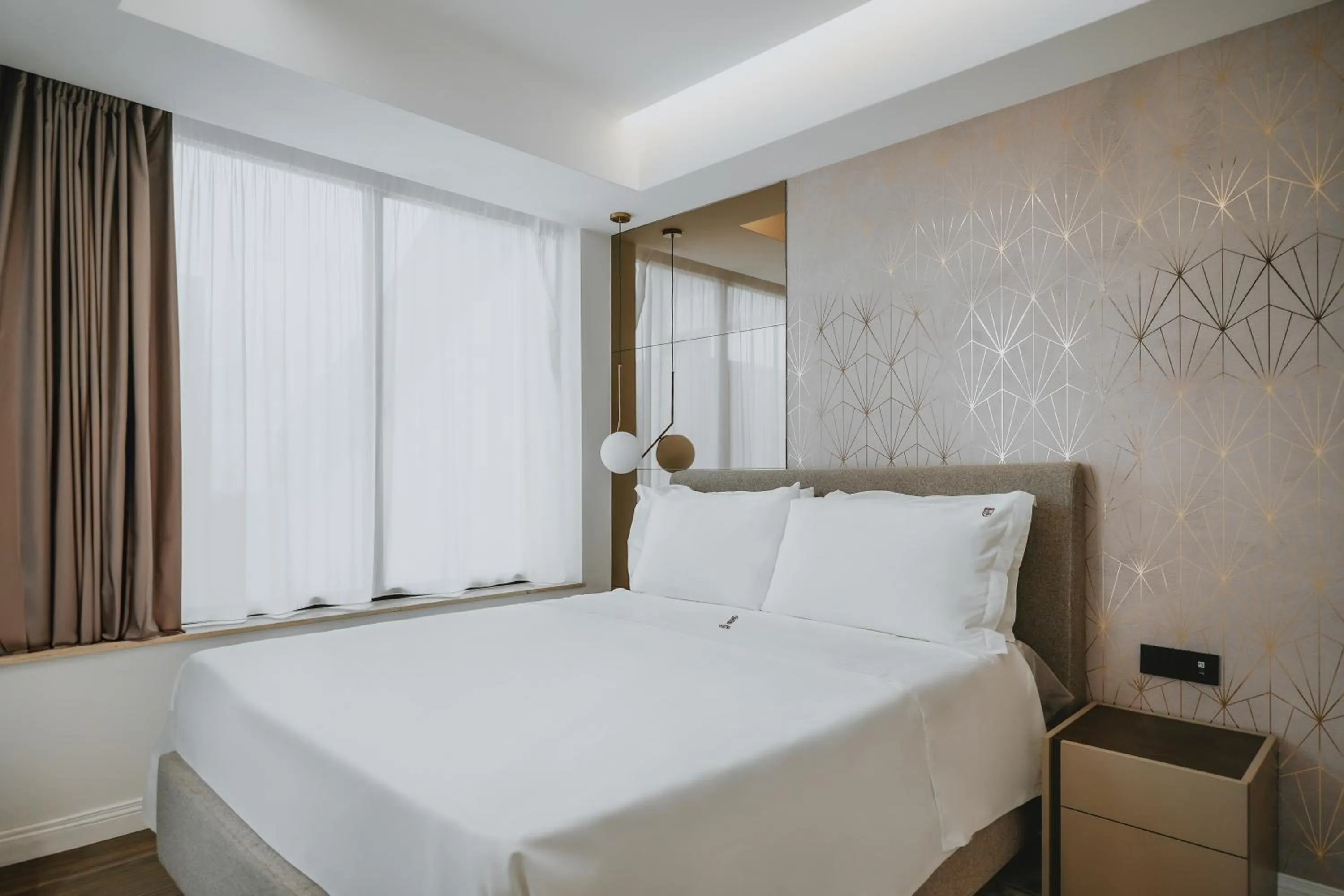 Bed in POETICA BOUTIQUE SKY HOTEL