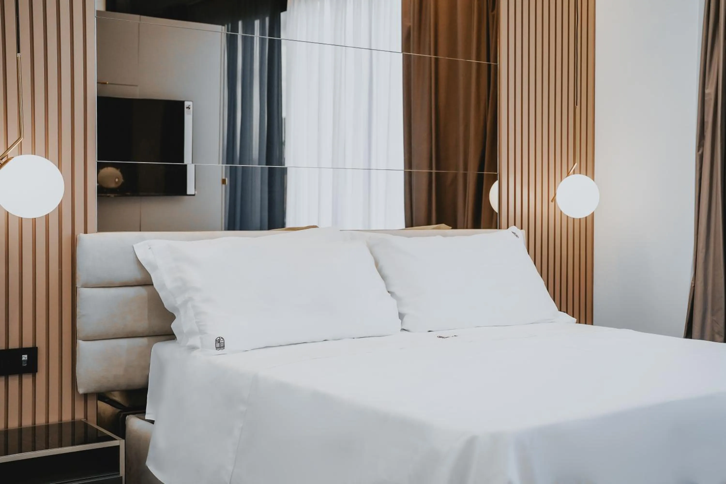 Bed in POETICA BOUTIQUE SKY HOTEL