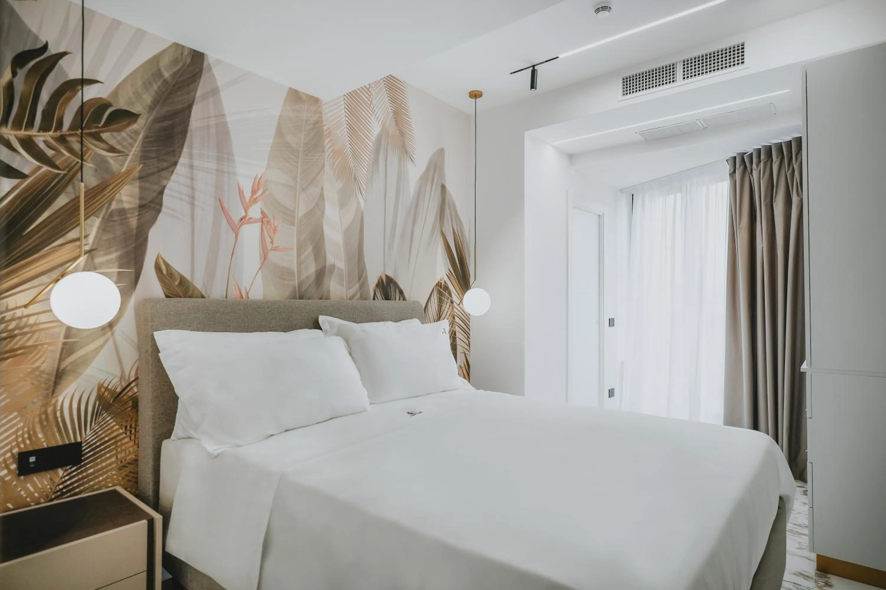 Bed in POETICA BOUTIQUE SKY HOTEL