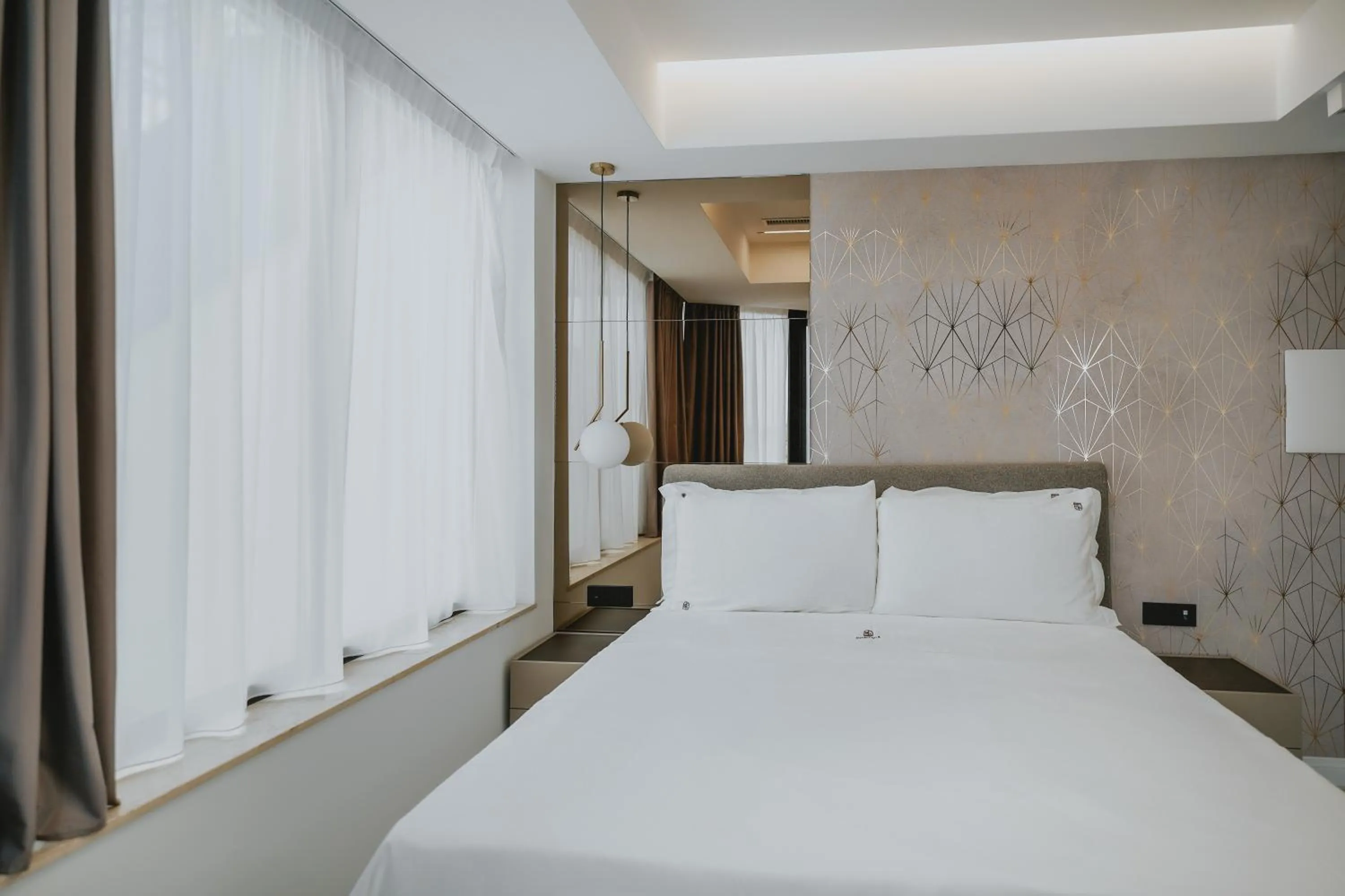 Bed in POETICA BOUTIQUE SKY HOTEL