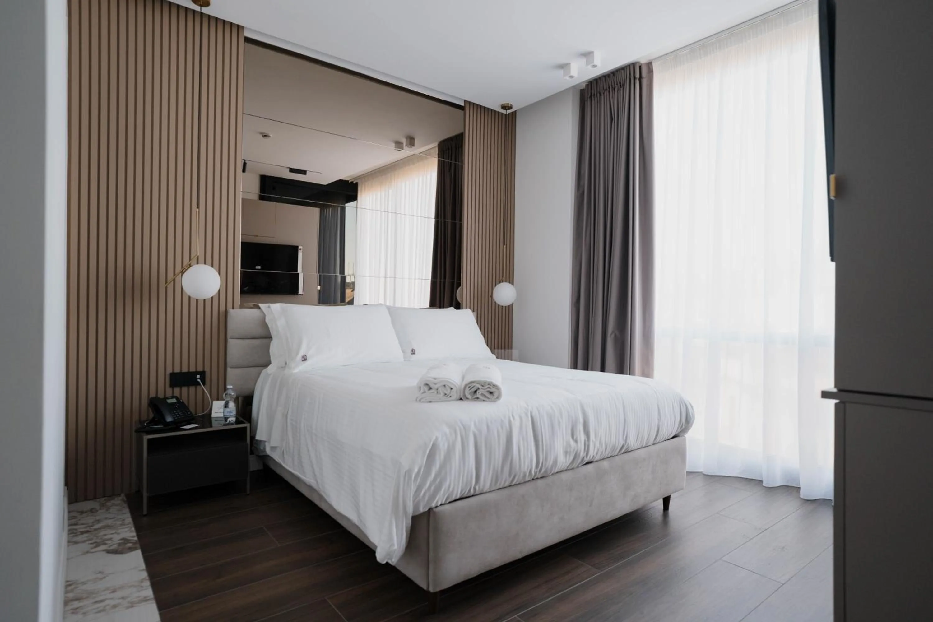 Bed in POETICA BOUTIQUE SKY HOTEL