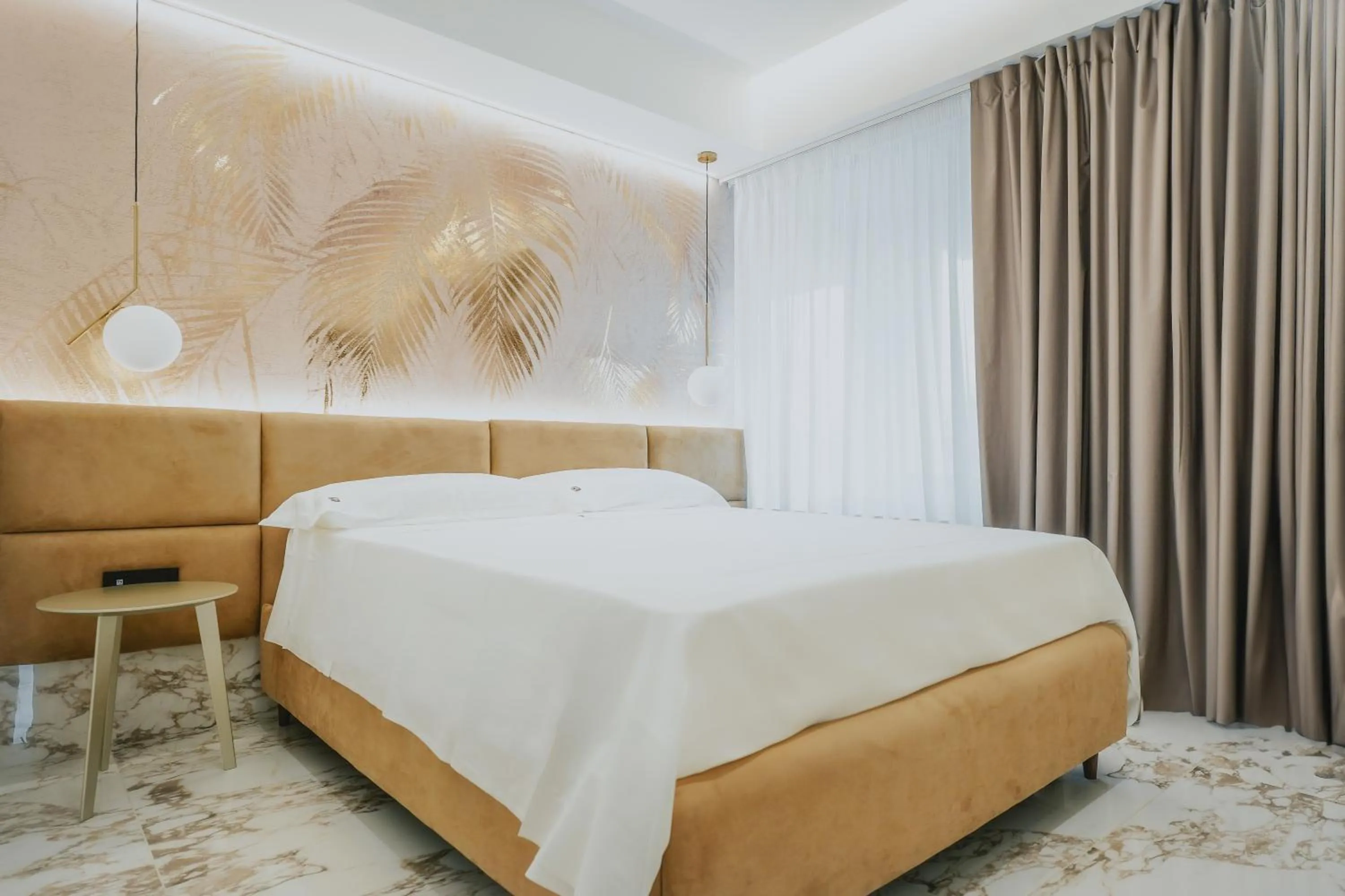 Bed in POETICA BOUTIQUE SKY HOTEL