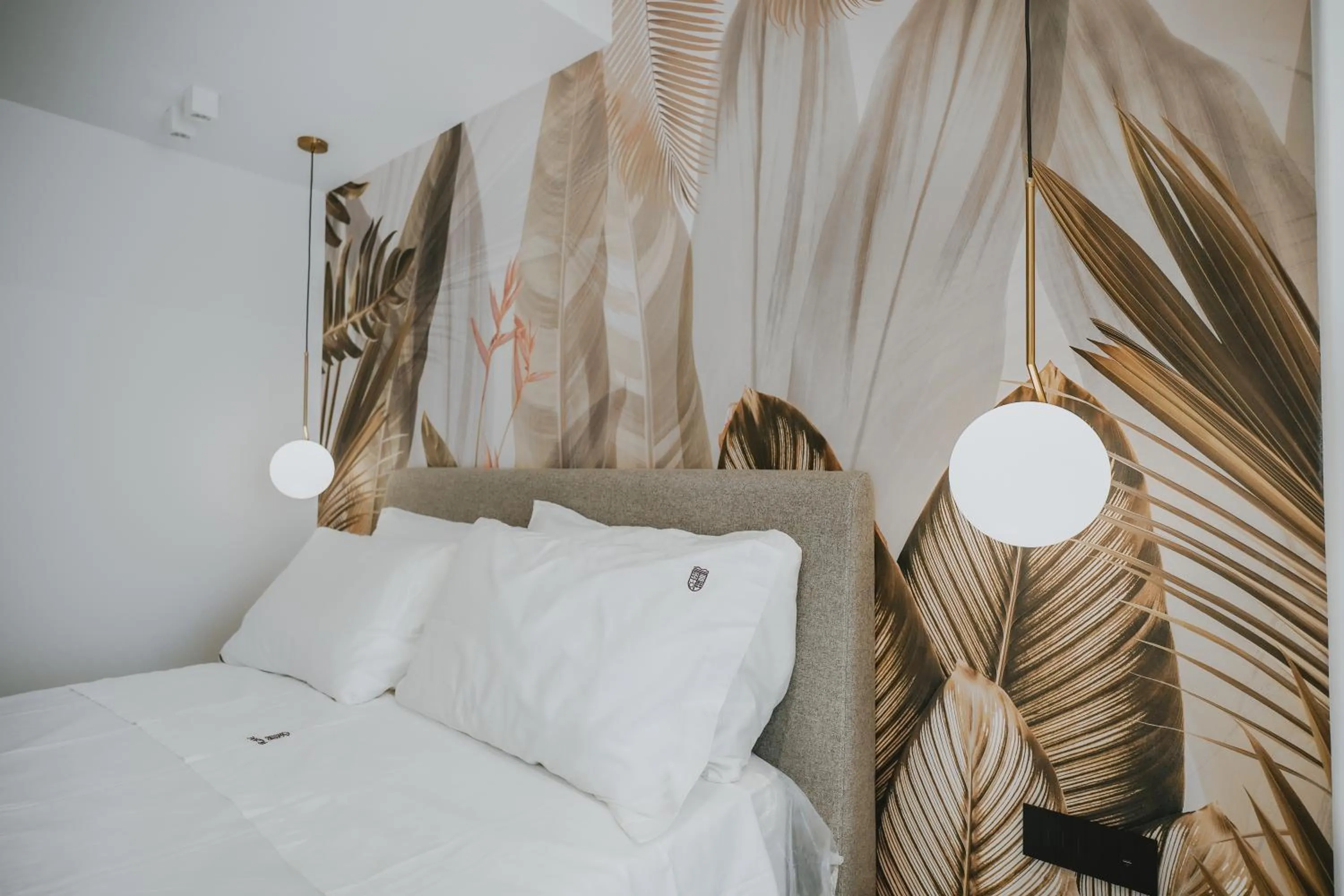 Bed in POETICA BOUTIQUE SKY HOTEL