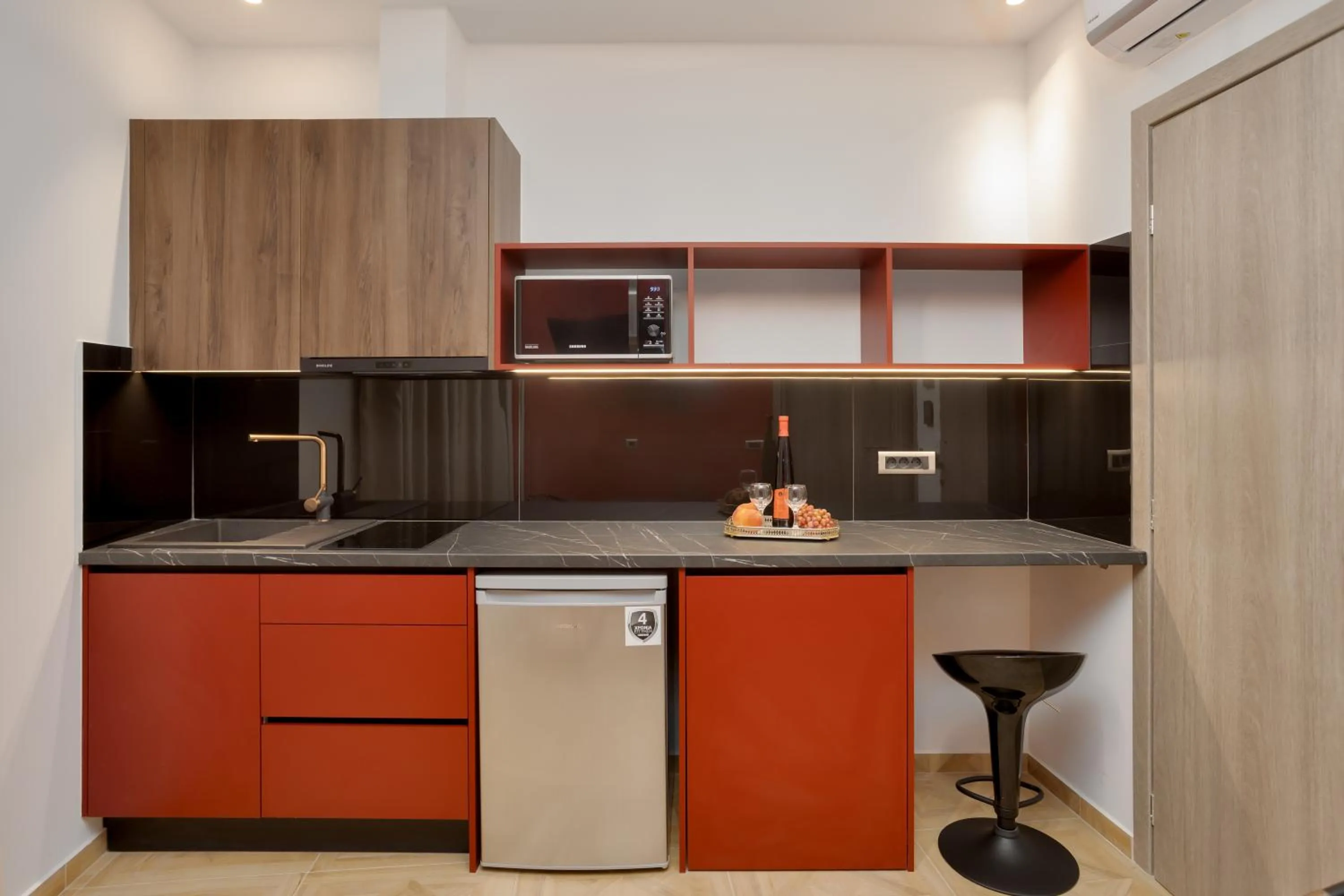 Kitchen or kitchenette in Royal Gold City Suites by Omilos Hotels