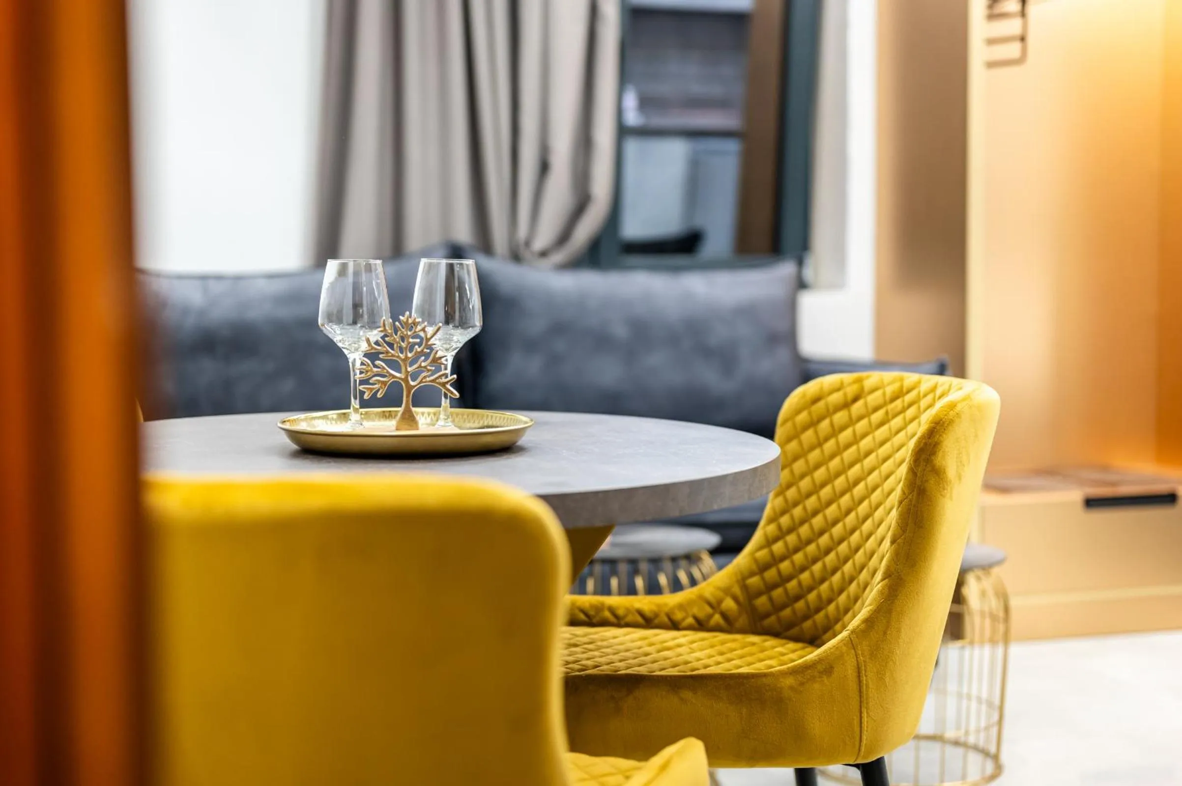 Living room in Royal Gold City Suites by Omilos Hotels