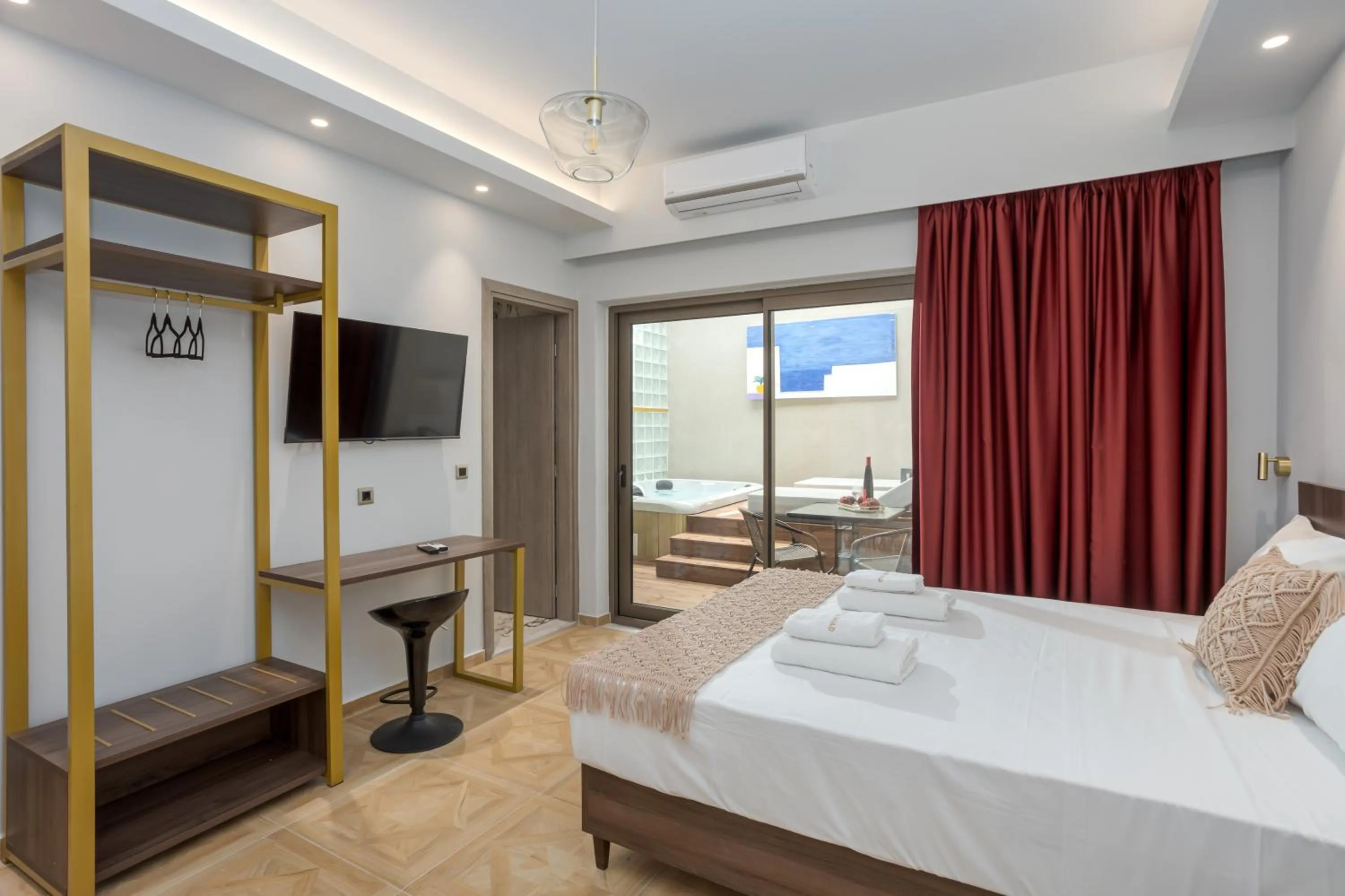 Bed in Royal Gold City Suites by Omilos Hotels