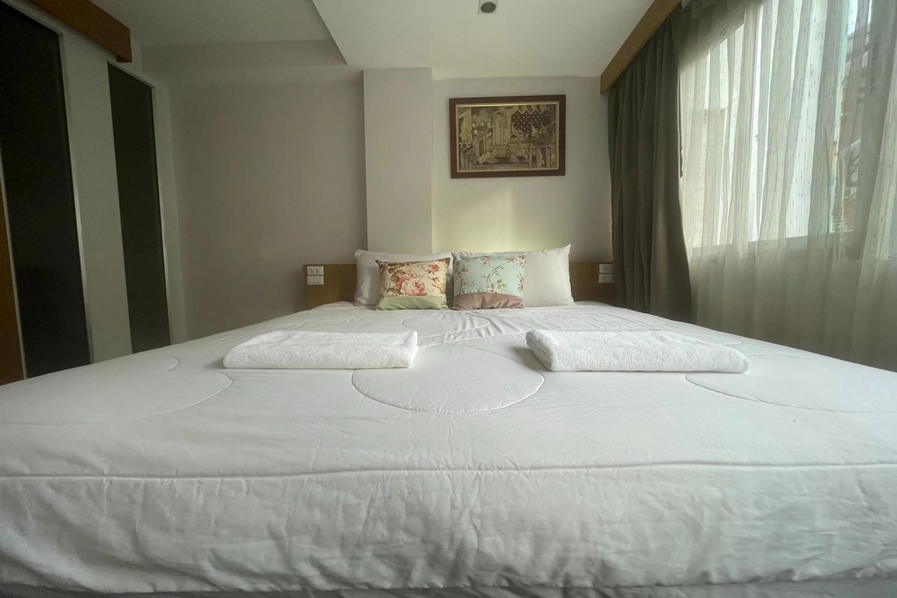 Bed in Landmark Patong Hotel
