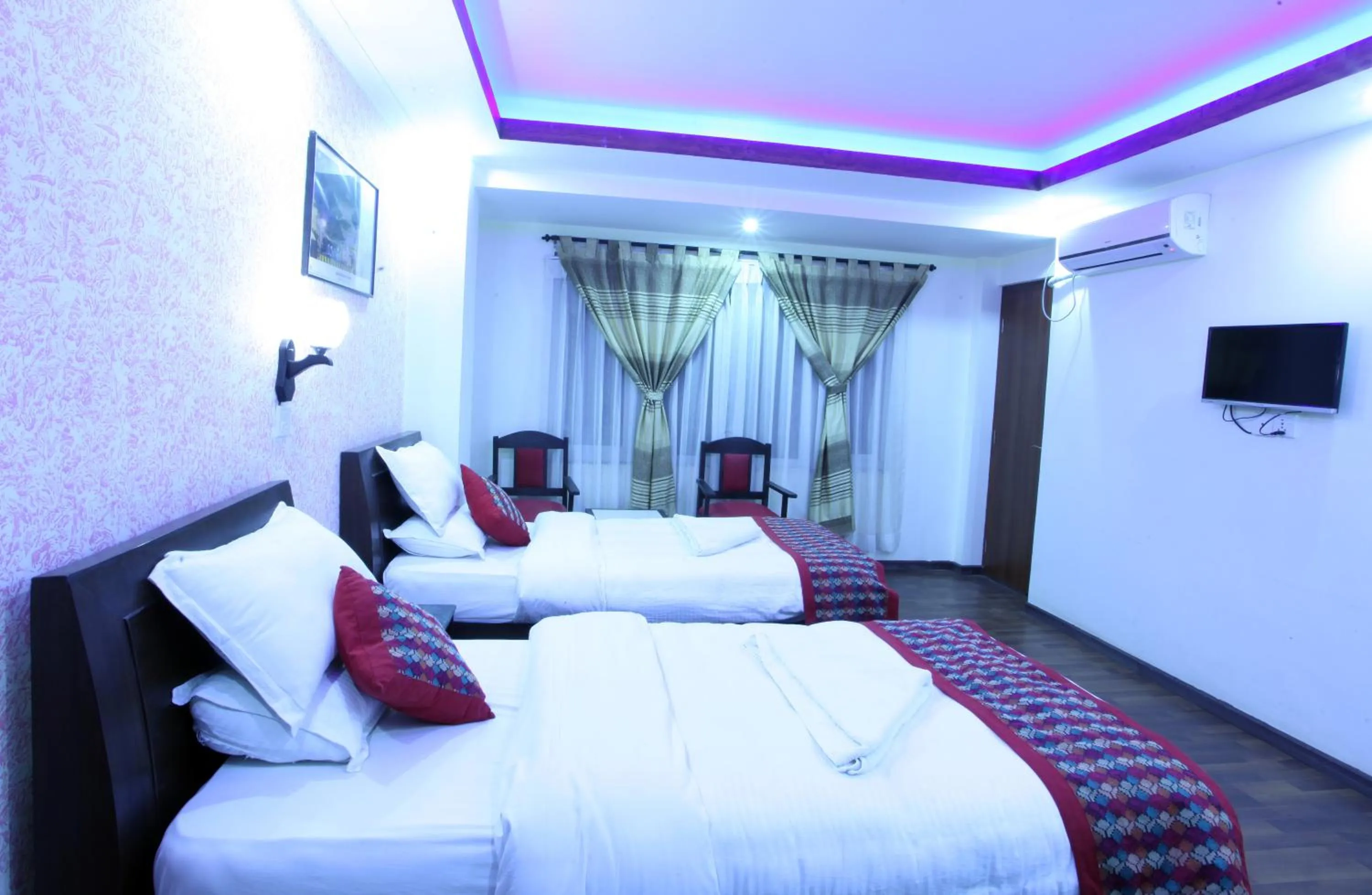 Bed in Alpine Hotel & Apartment