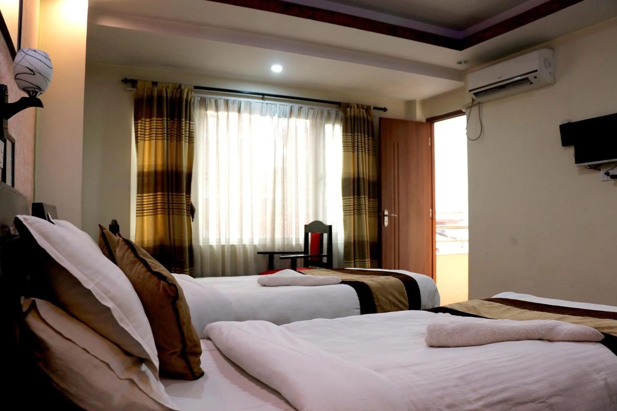 Bedroom in Alpine Hotel & Apartment