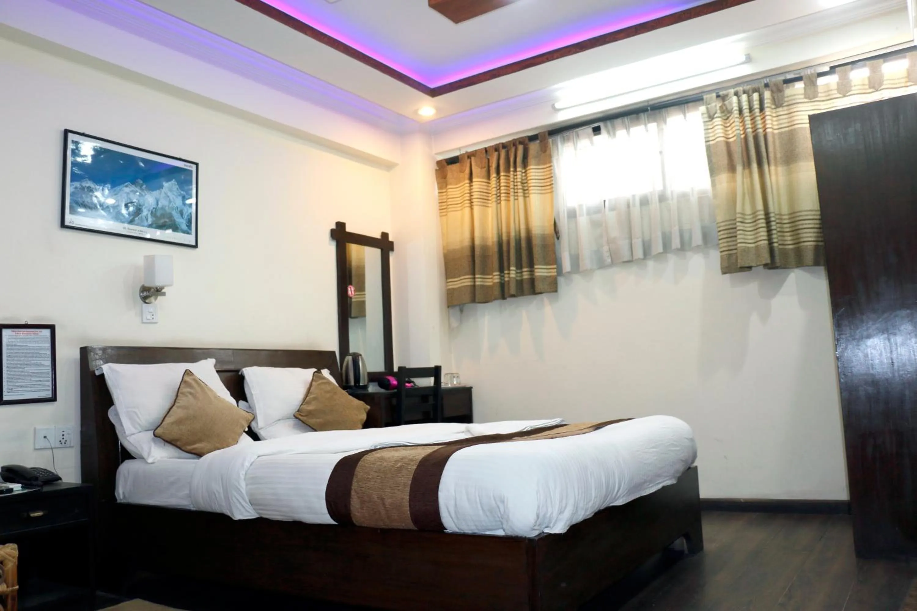 Bedroom in Alpine Hotel & Apartment