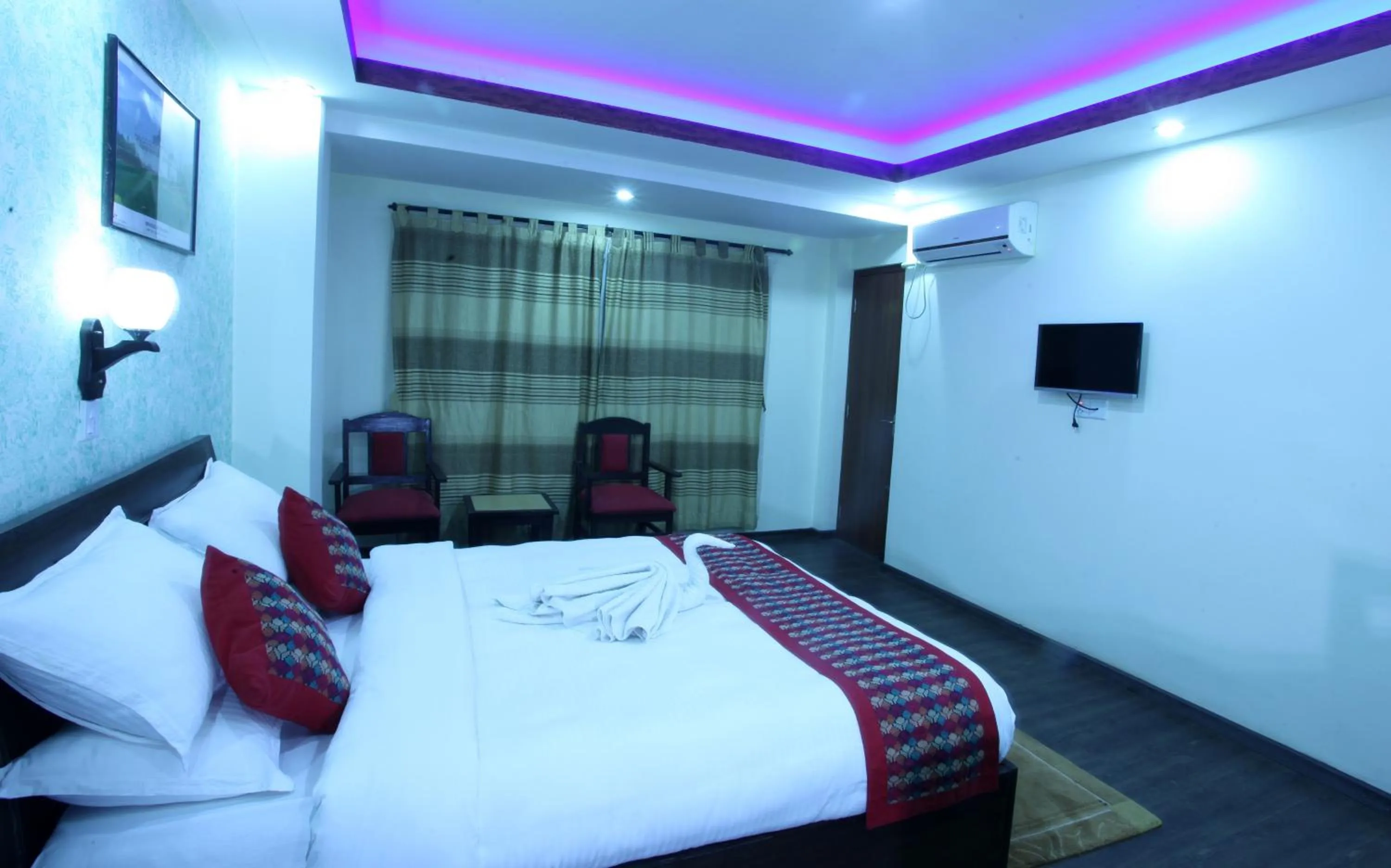 Bed in Alpine Hotel & Apartment