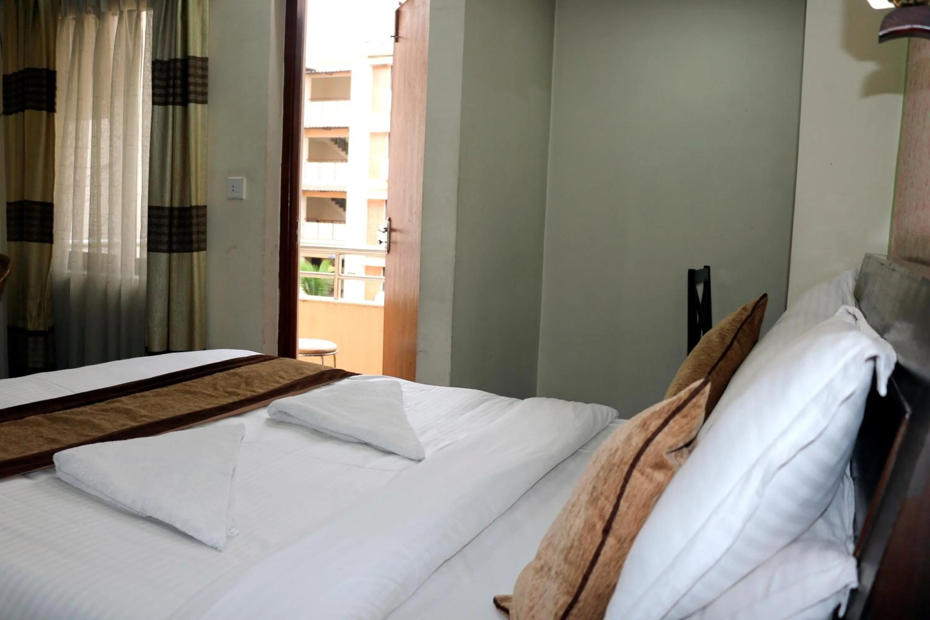 Bedroom in Alpine Hotel & Apartment