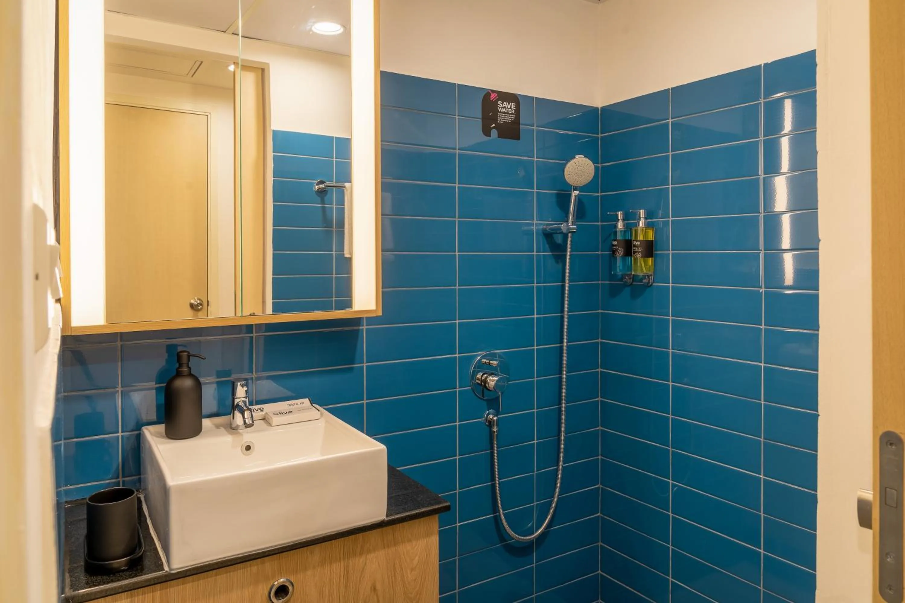 Bathroom in Olive Hotel Brookefield by Embassy Group