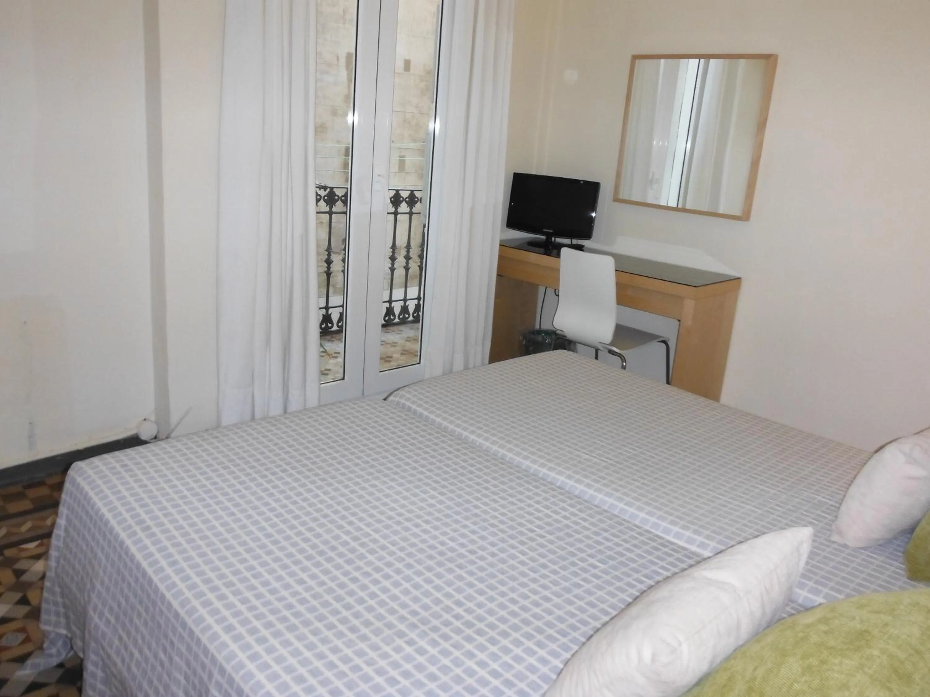 Bed in Hostal Eixample