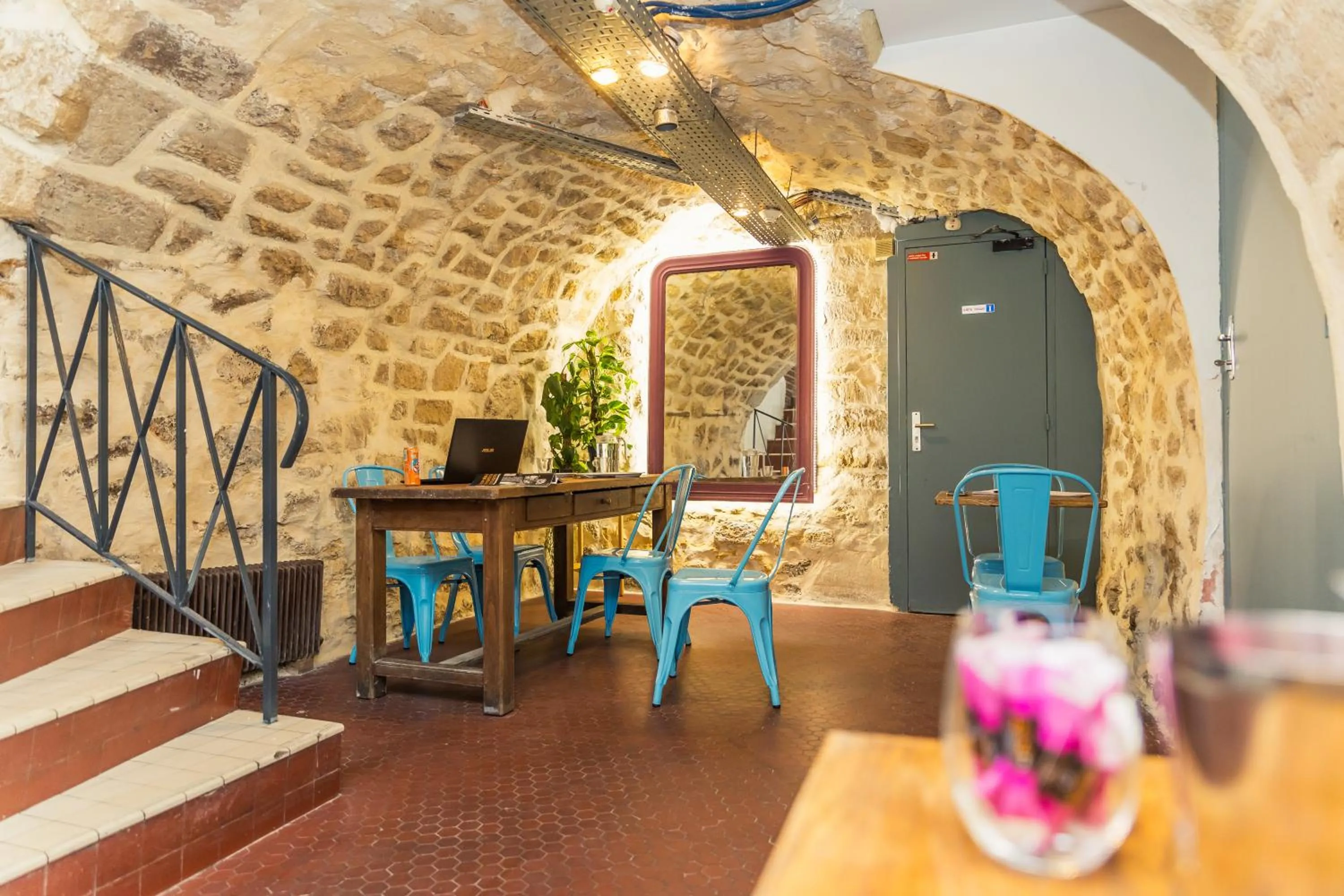 Seating area in Young and Happy Latin Quarter by Hiphophostels