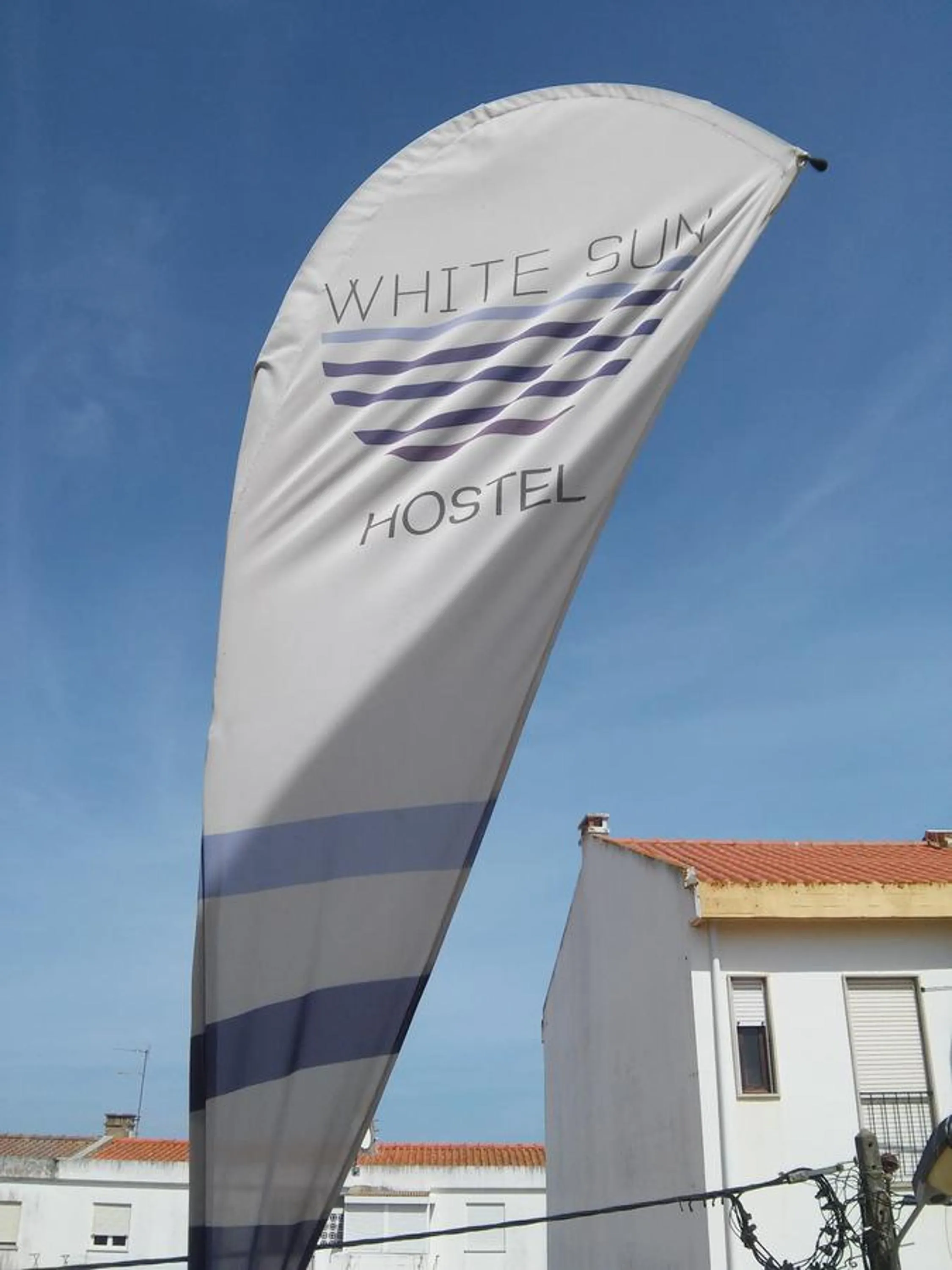 Property logo or sign in White Sun Hostel