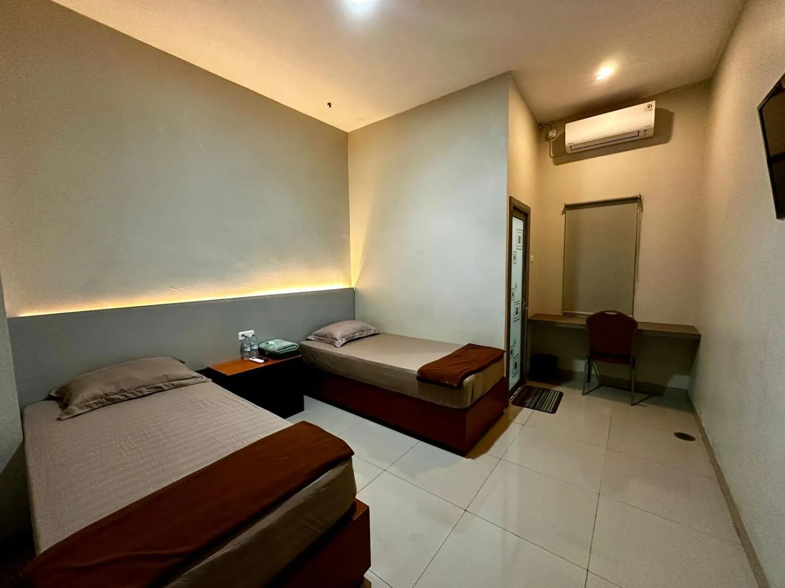 Bed in Grands Orchid Hotel