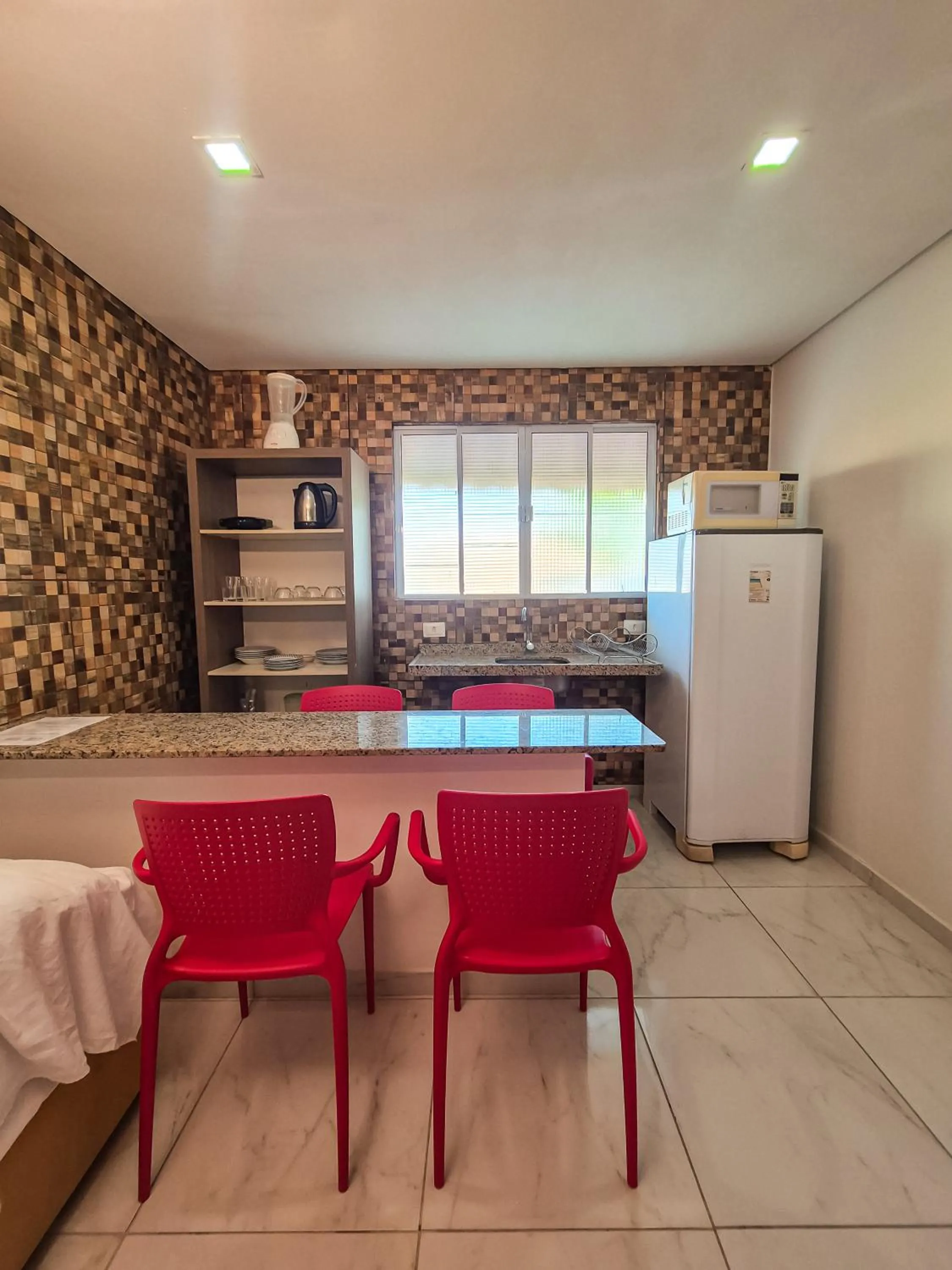 Kitchen or kitchenette in Pousada Cheiro do Mar