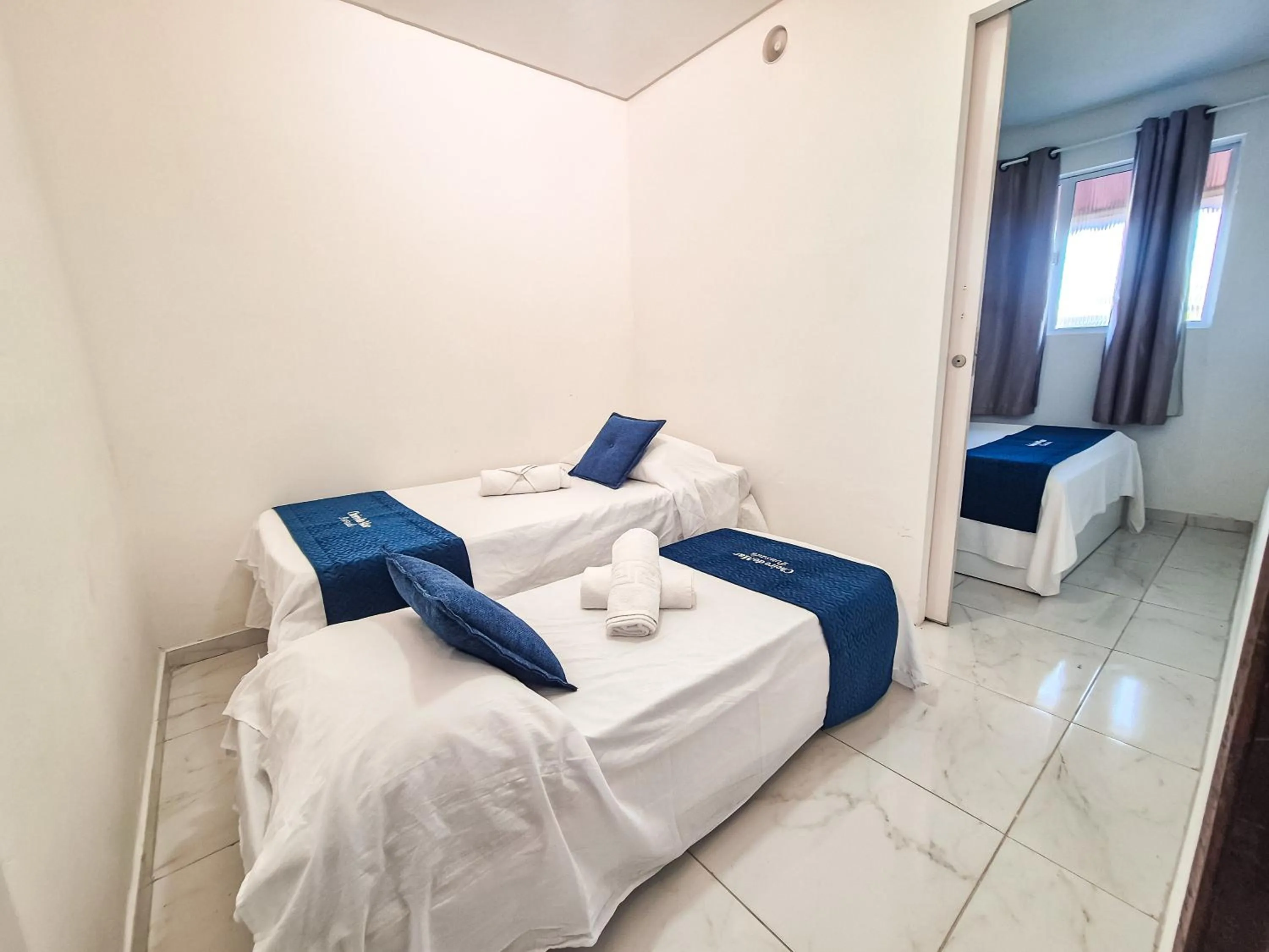 Bed in Pousada Cheiro do Mar