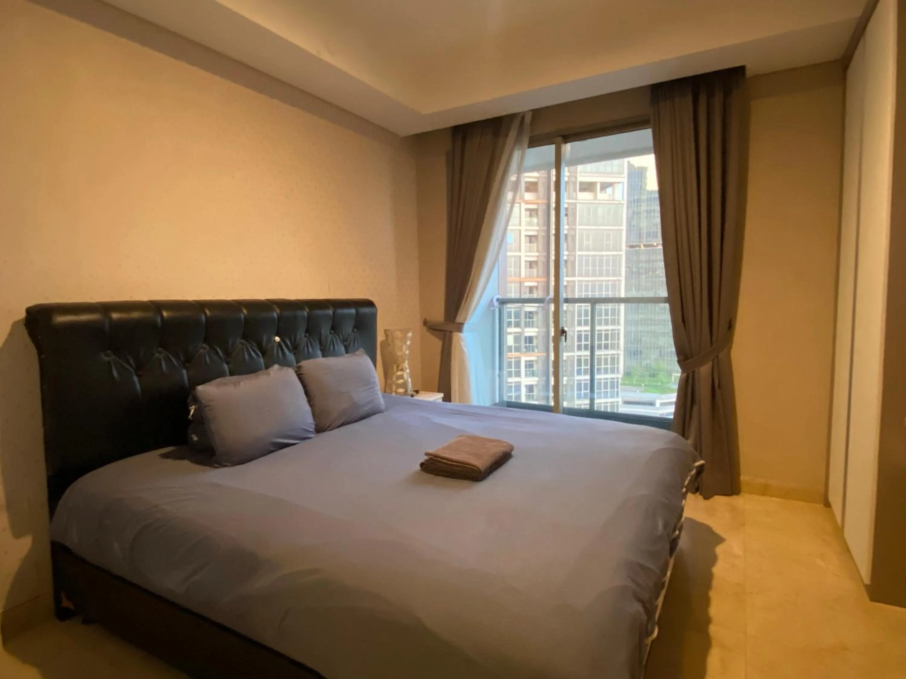 Bed in Comfort and Luxury Private Room at Goldcoast PIK