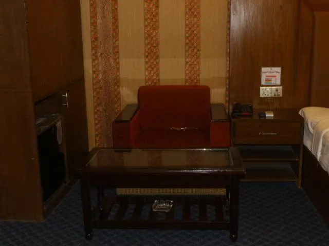 Seating area, Bed in New Hotel Grand View