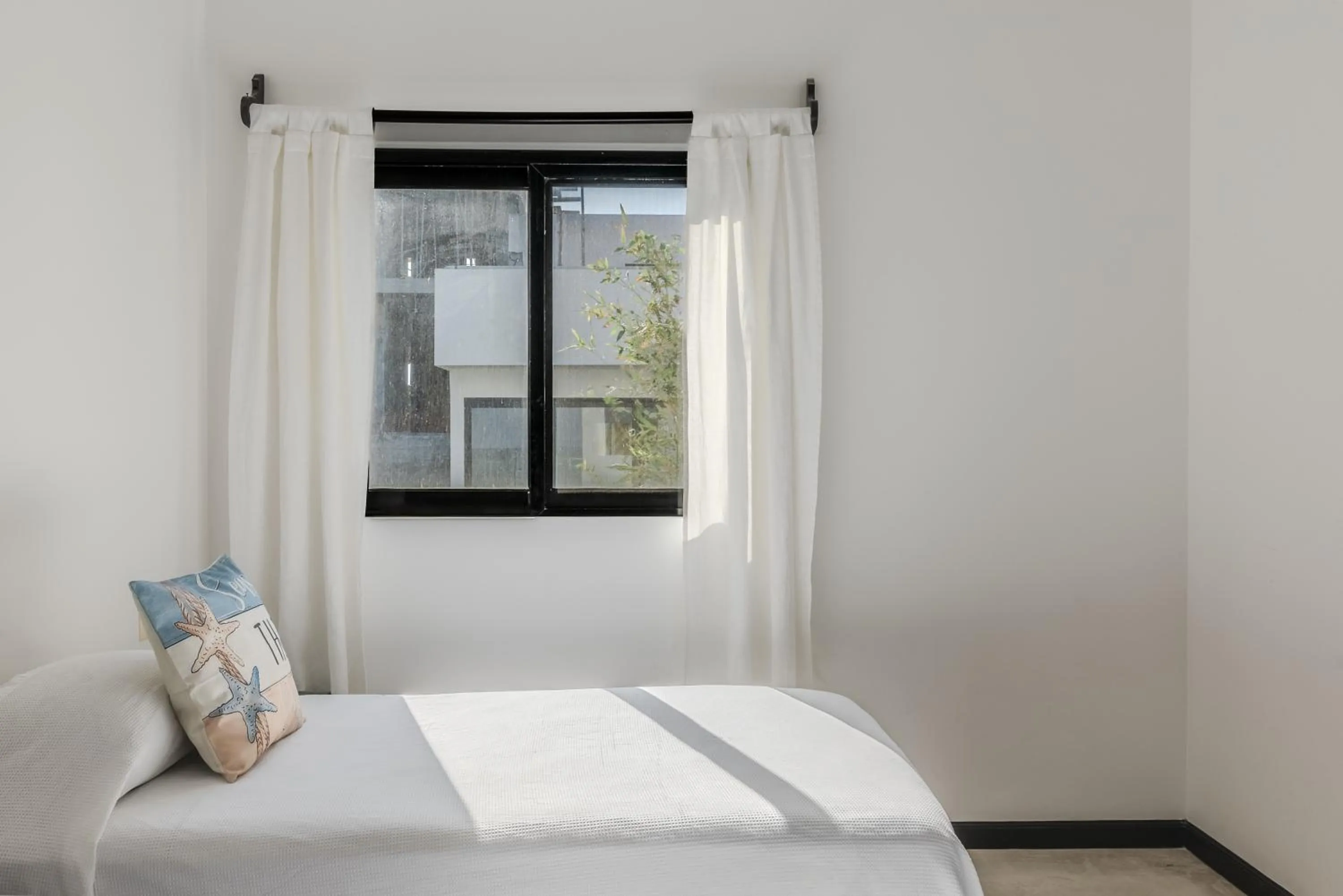 Bed in Vela's Condos Ocean Front