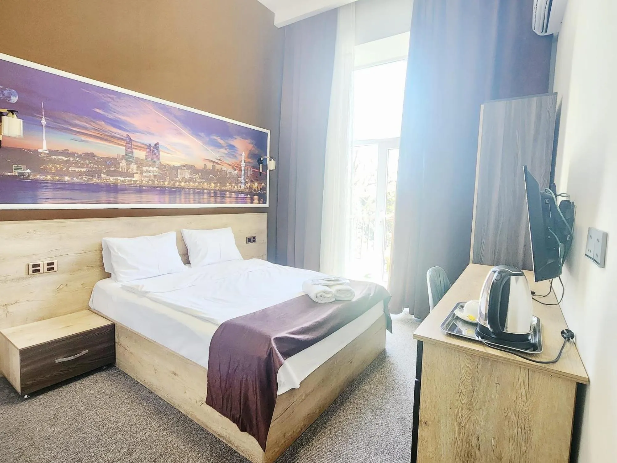 Bed in ELYSIUM HOTEL