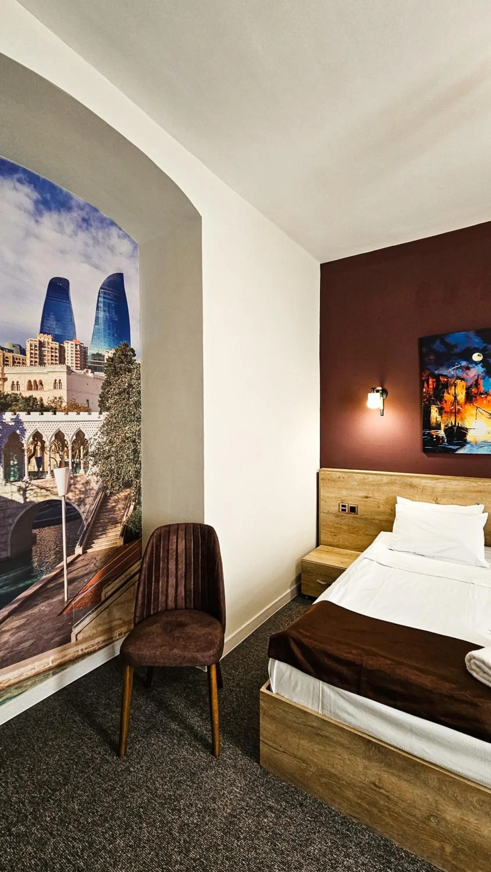 Bed in ELYSIUM HOTEL