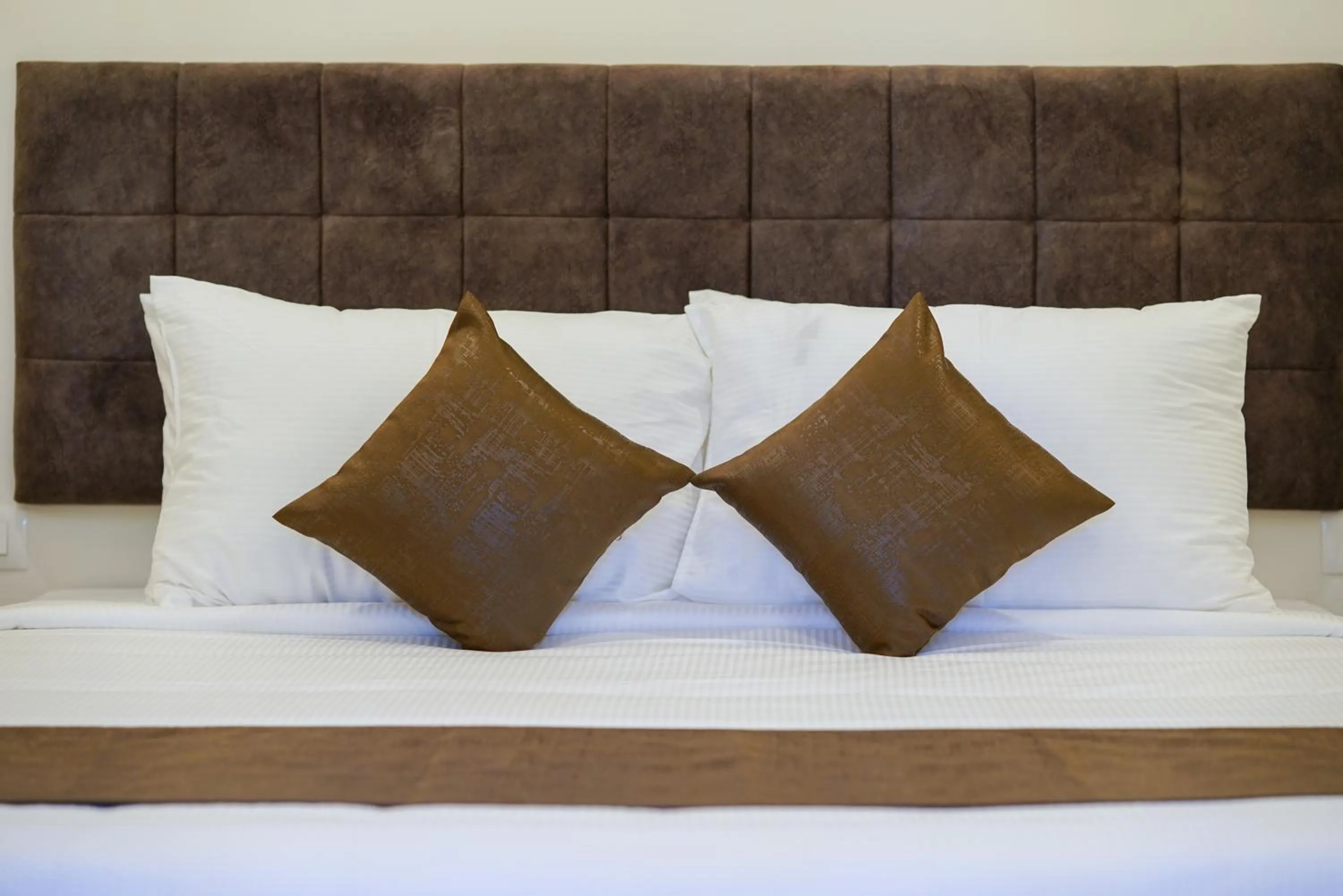 Bed in Grand Plaza Inn