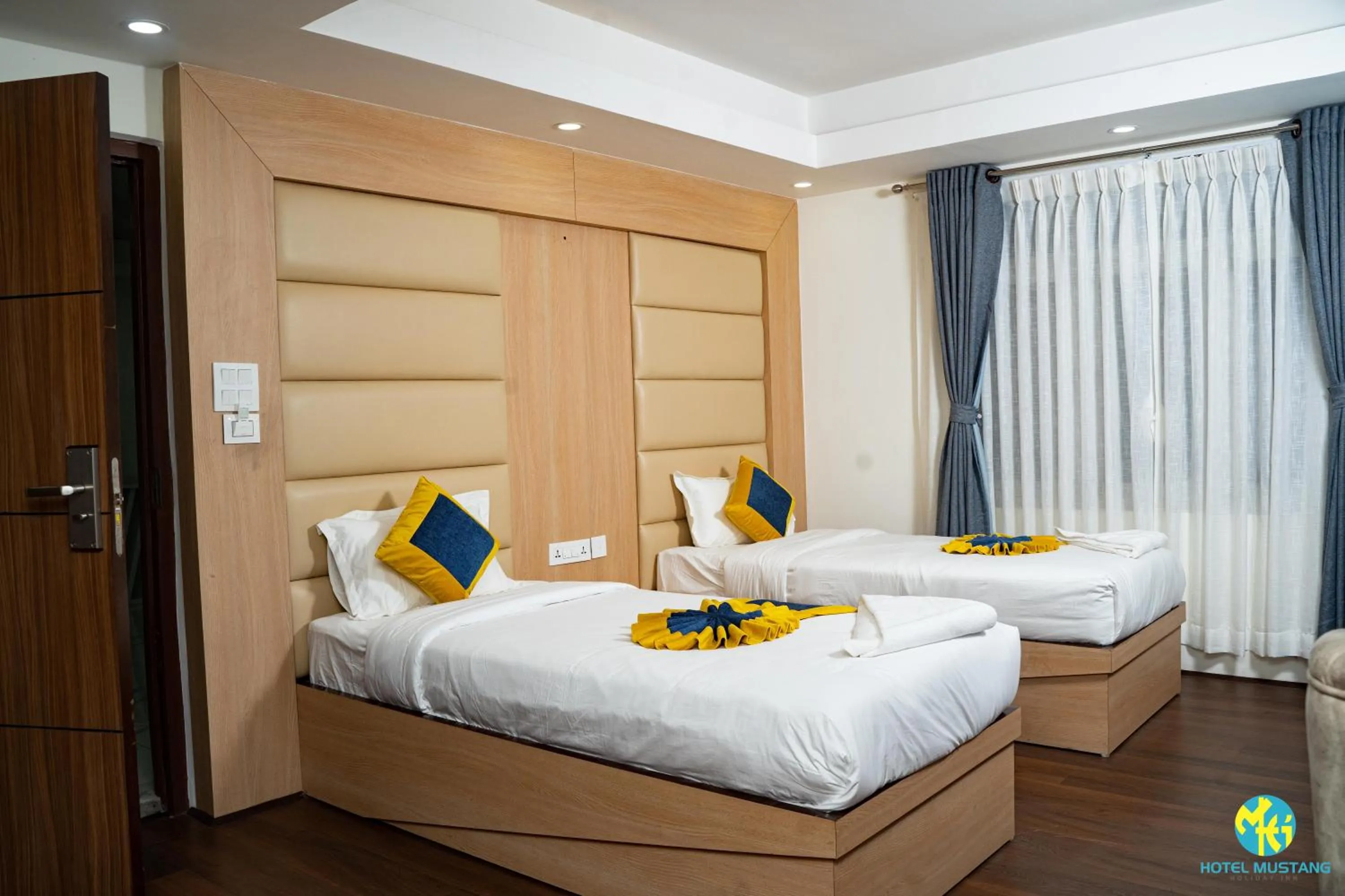 Bedroom in Hotel Mustang Holiday Inn