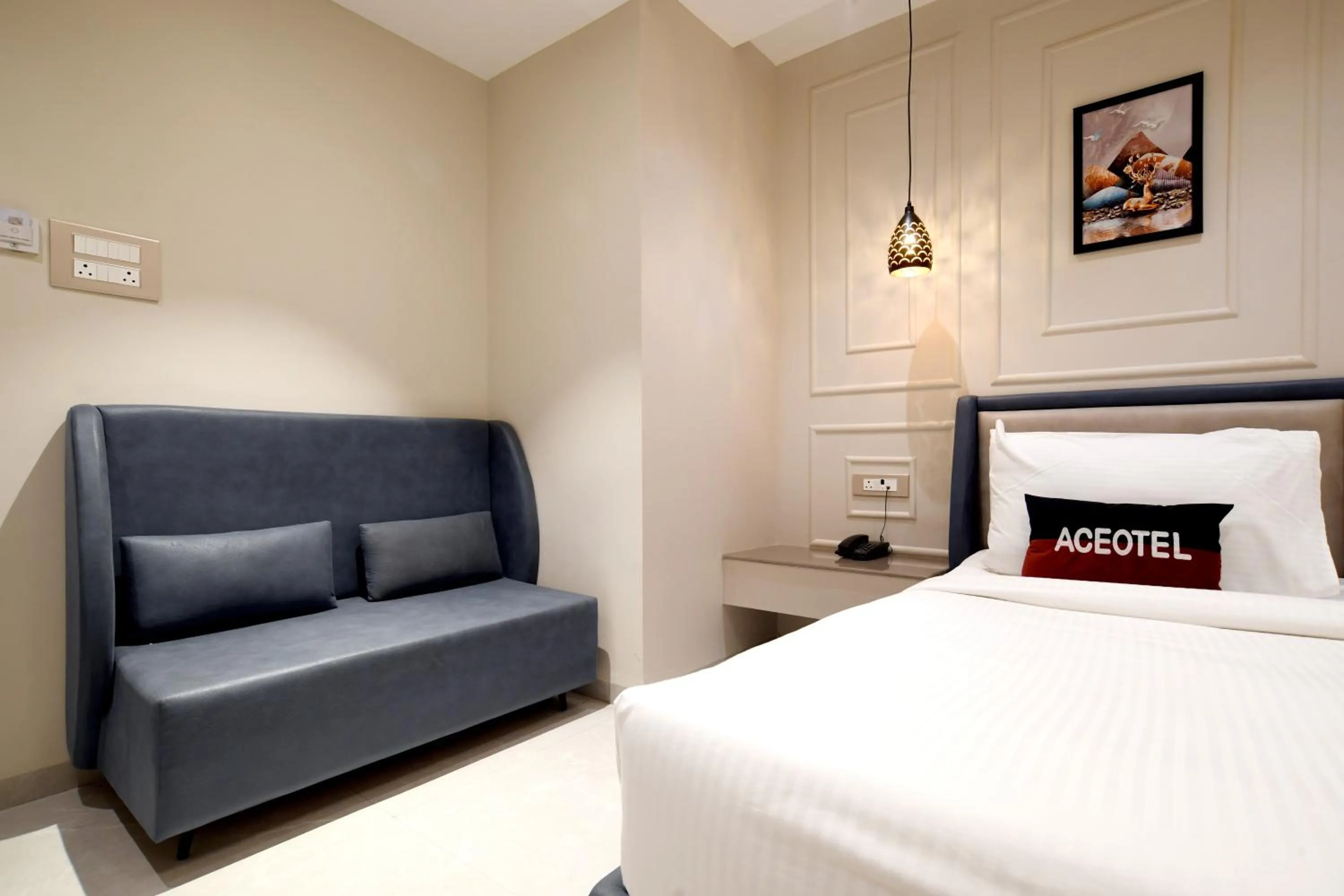 Seating area, Bed in Aceotel Select Tulsi Vijay Nagar- A Luxury Boutique Hotel