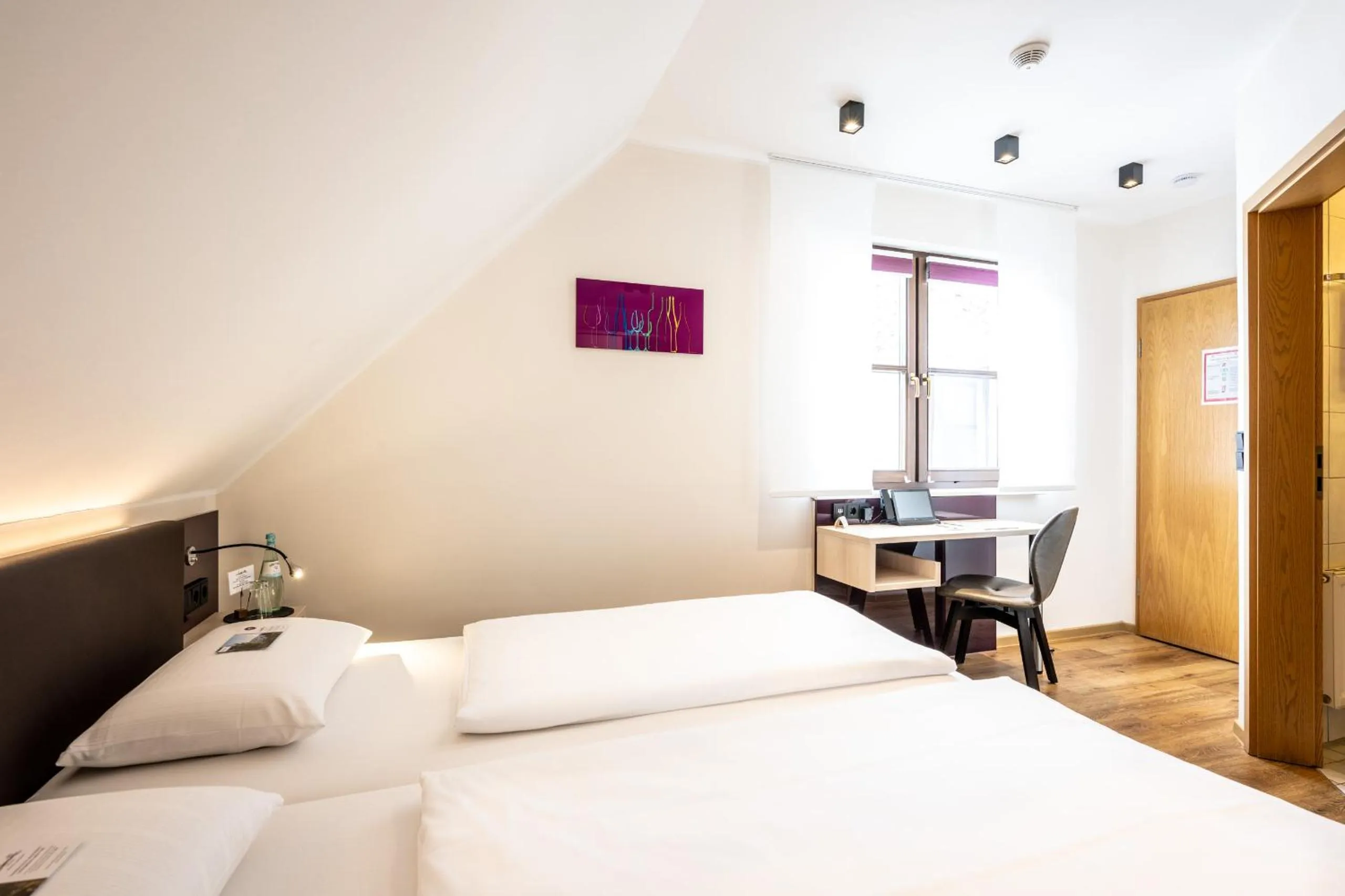 Photo of the whole room, Bed in Weinhotel Restaurant Klostermühle