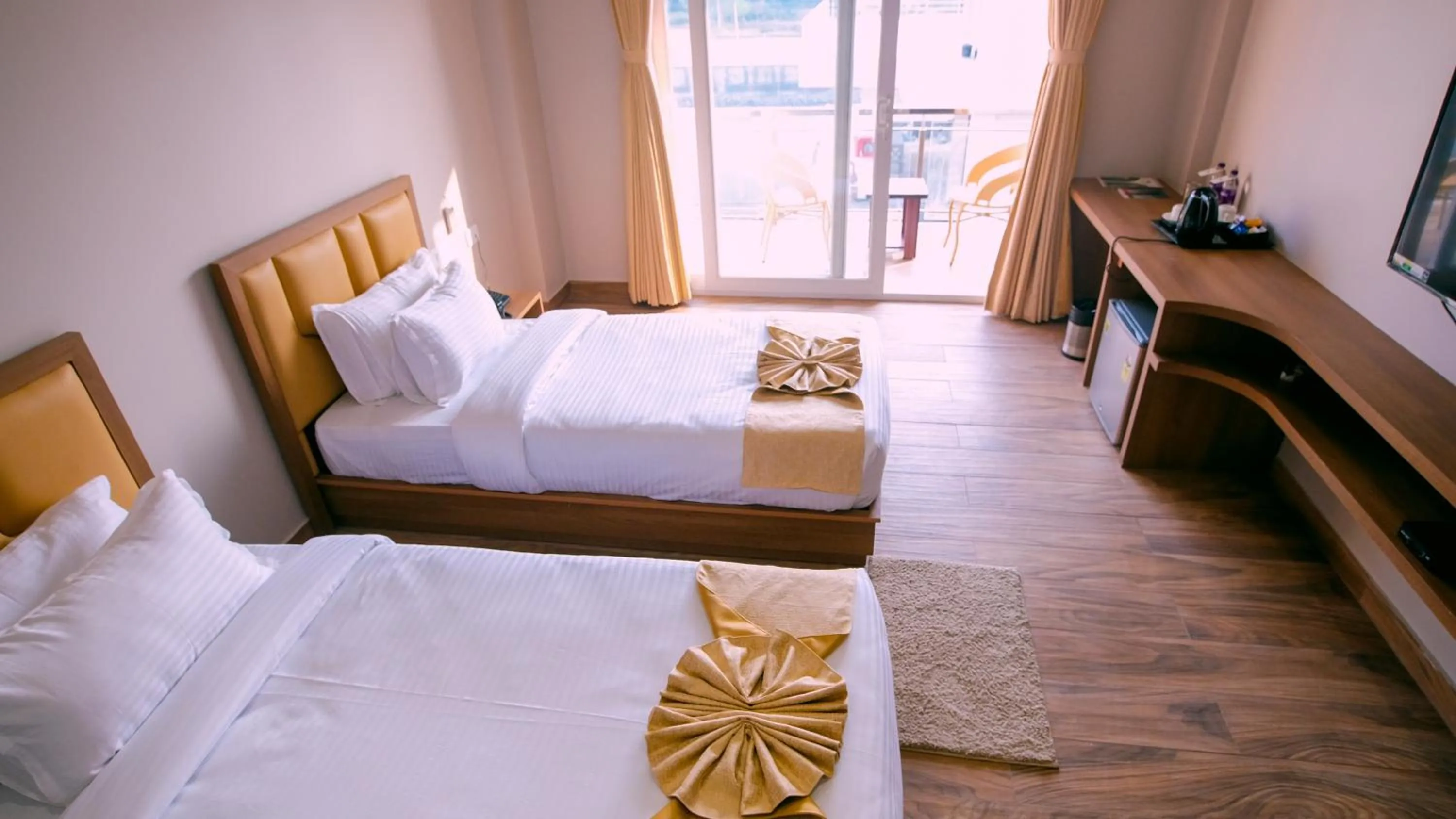 Bed in Finn's Weaver Resort, Kaziranga