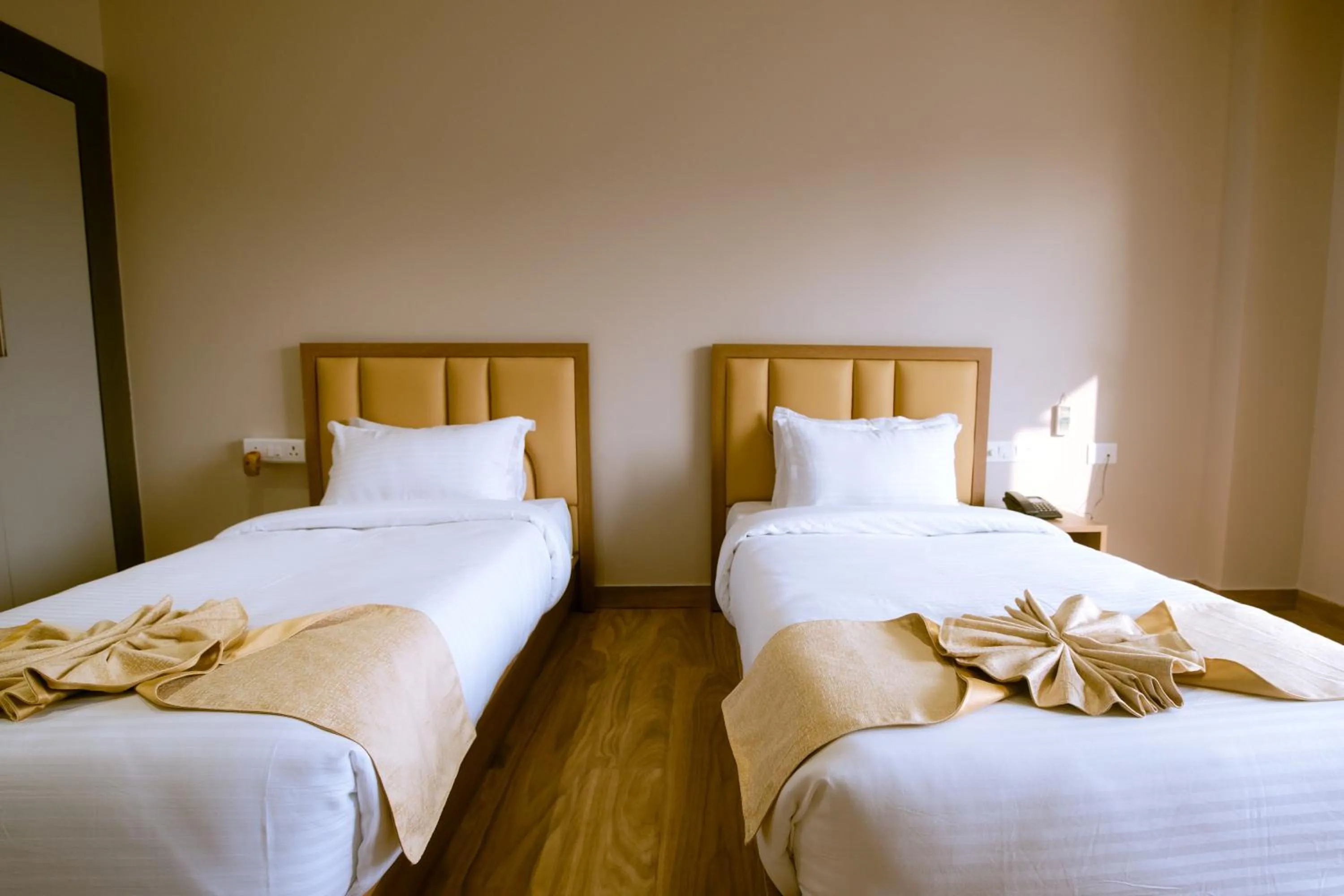 Bed in Finn's Weaver Resort, Kaziranga