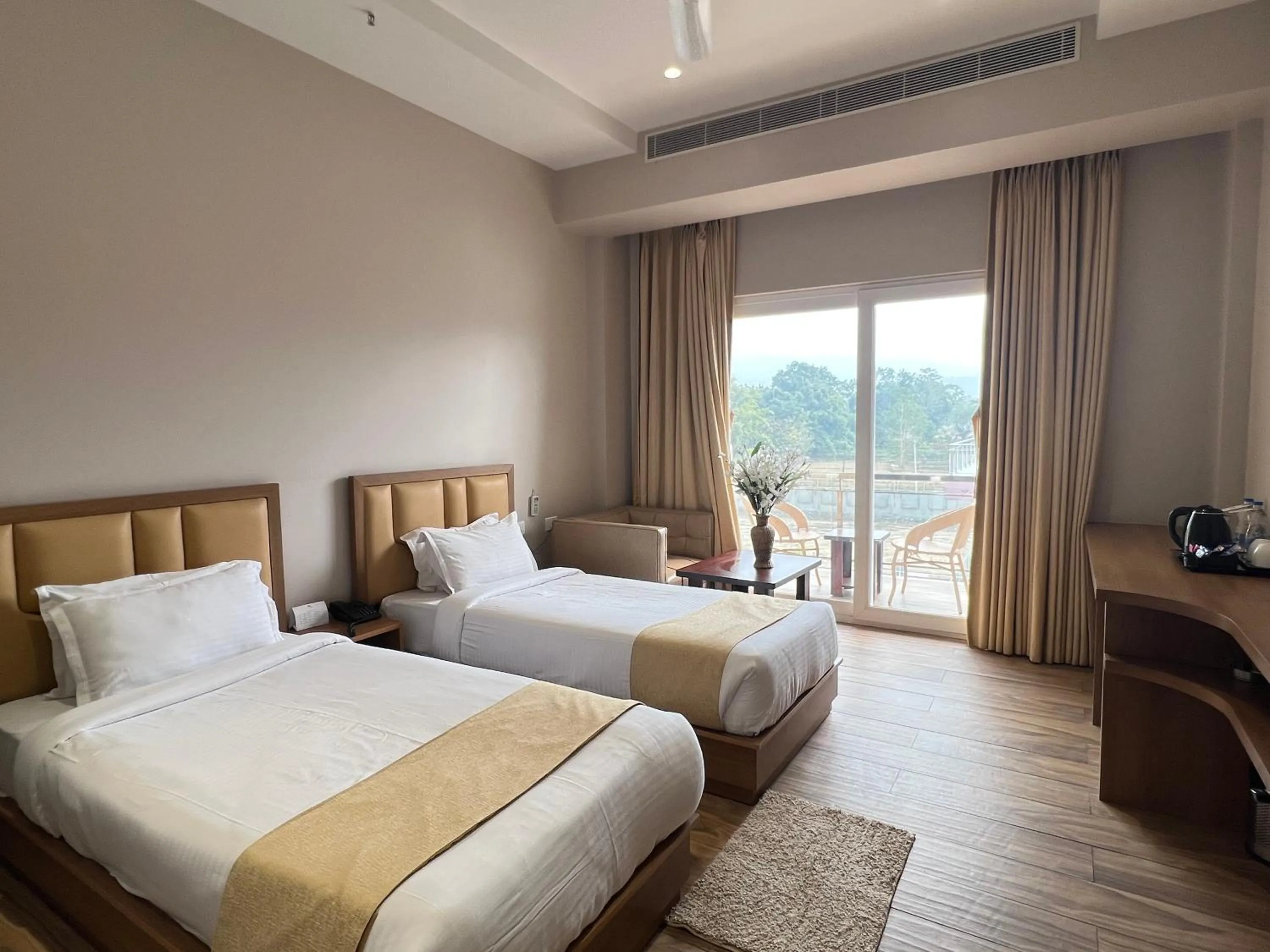 Bed in Finn's Weaver Resort, Kaziranga