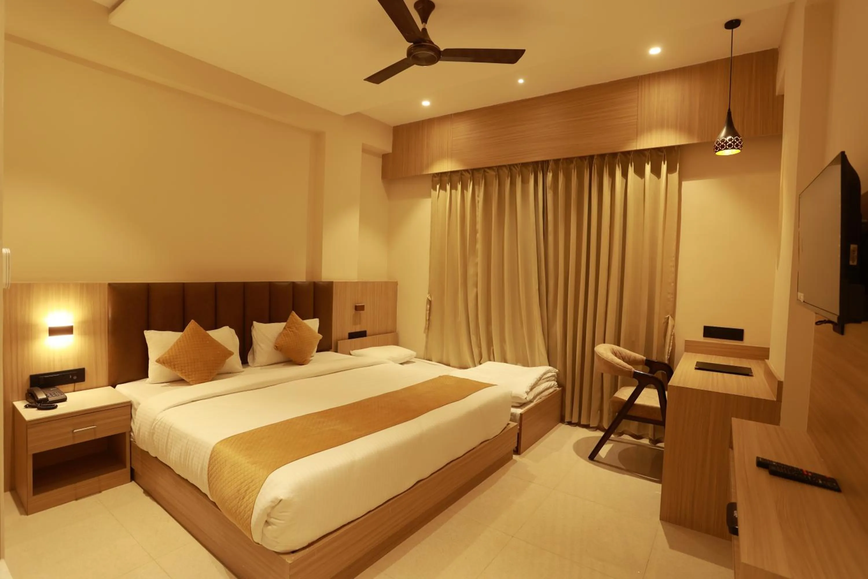 Bed in Hotel Taviral Regency