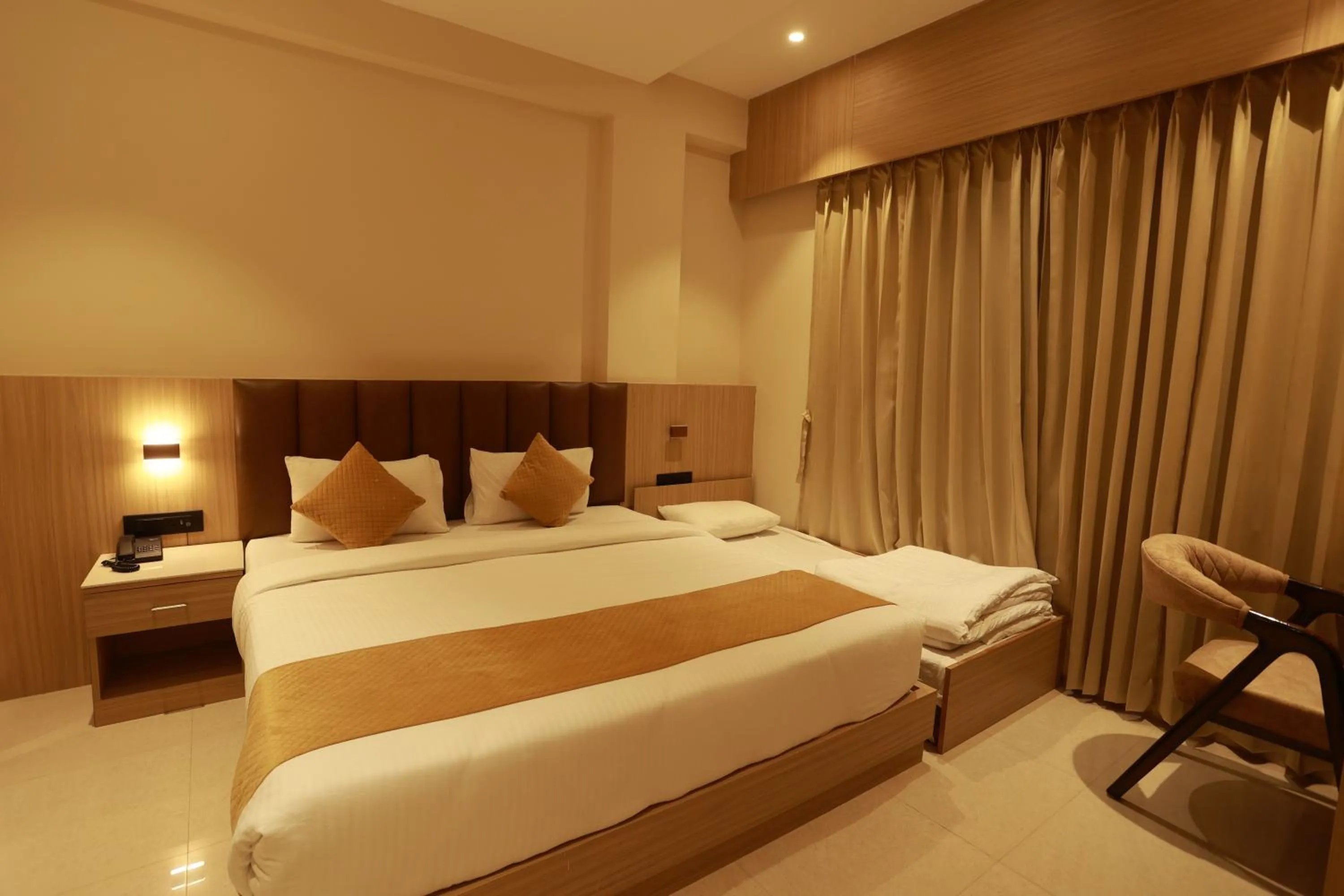 Bed in Hotel Taviral Regency