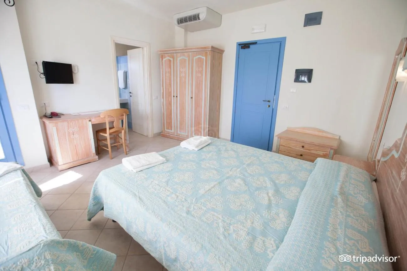 Bed in Colostrai Hotel Club