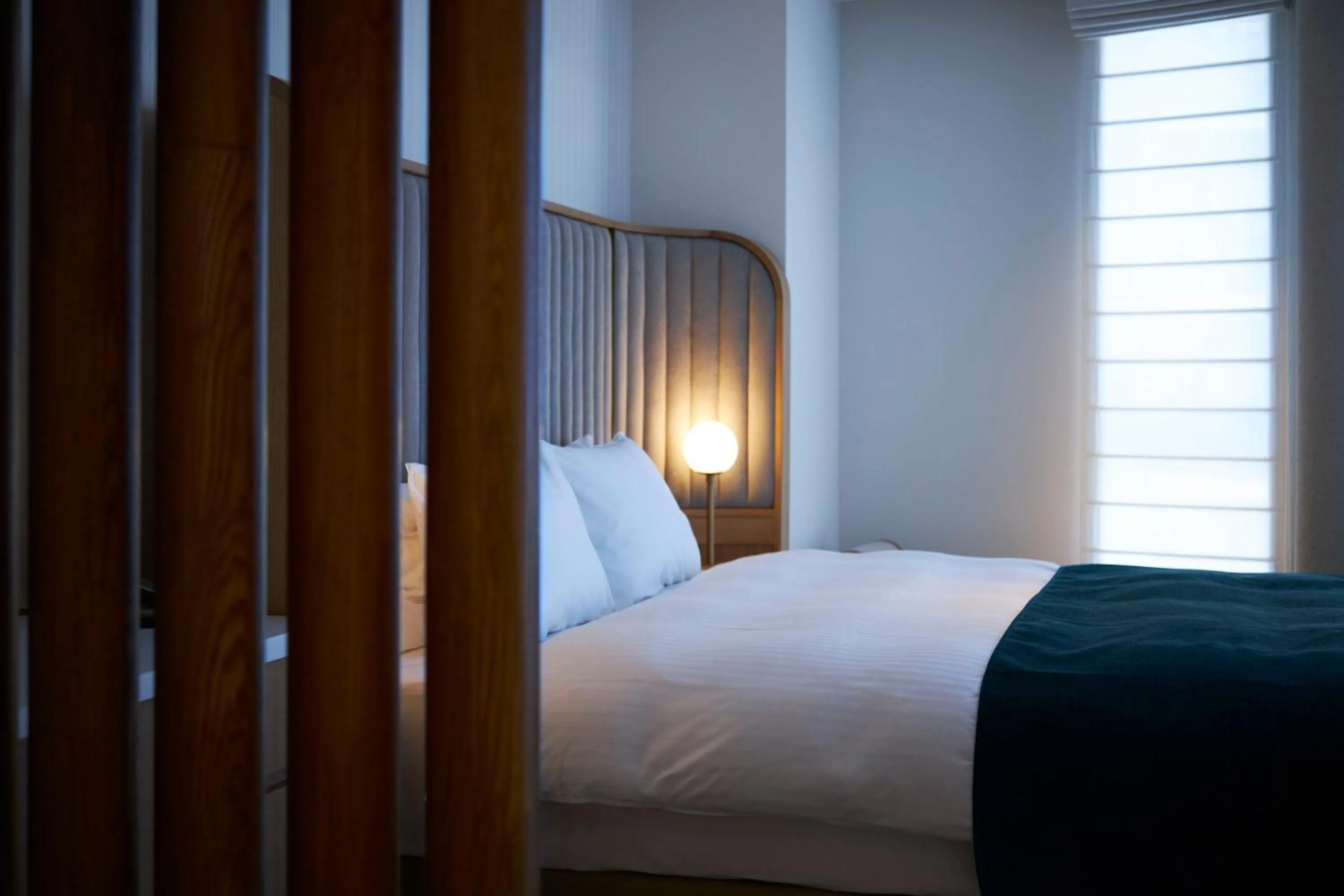 Bed in Hotel Comento Yokohama Kannai