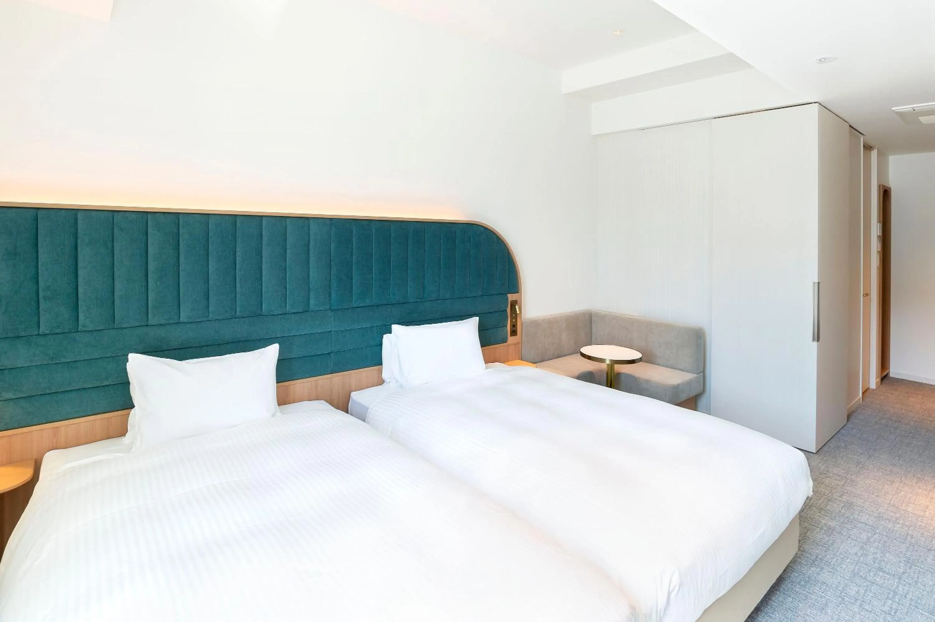 Bed in Hotel Comento Yokohama Kannai