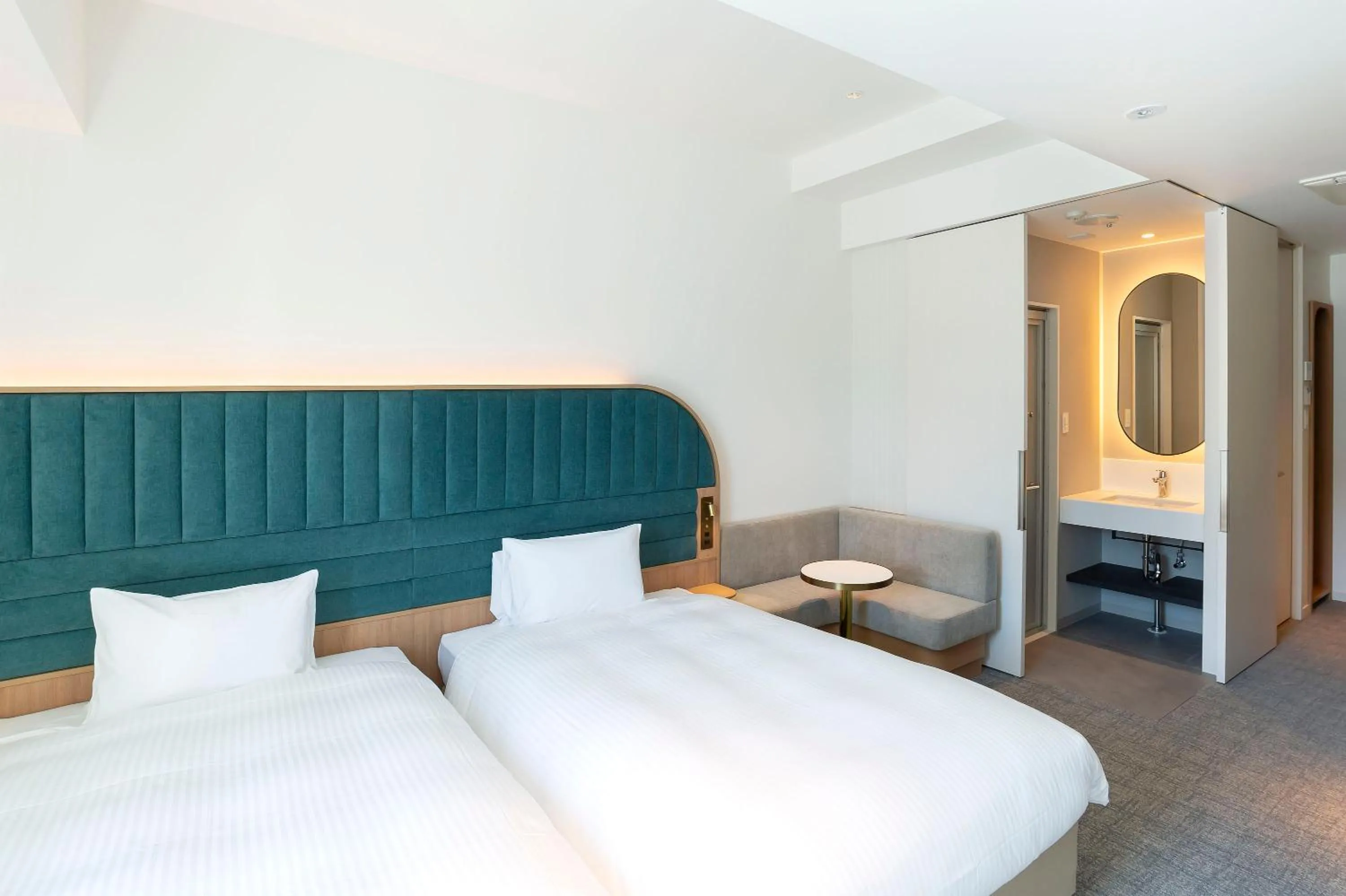 Bed in Hotel Comento Yokohama Kannai