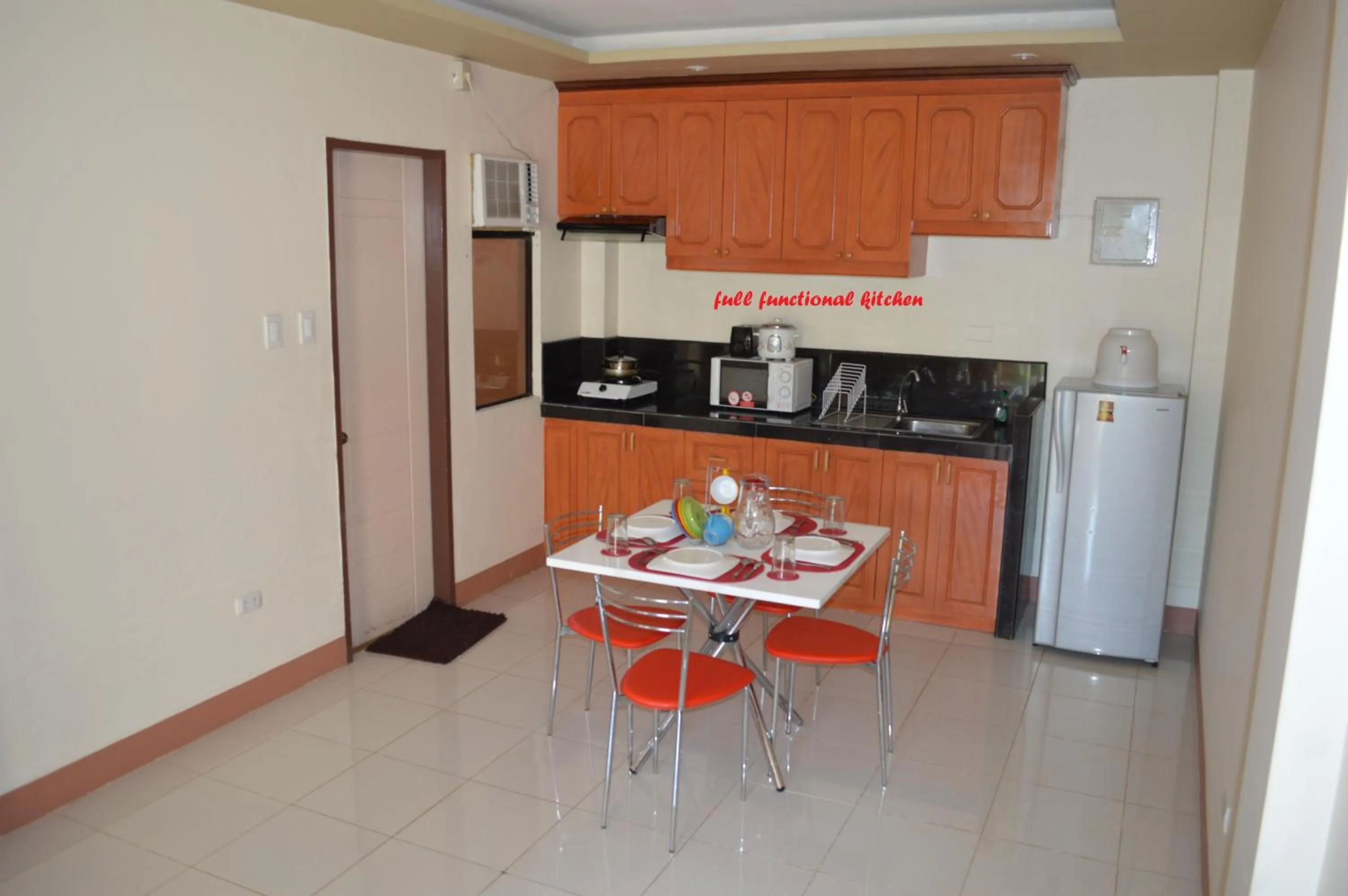 Kitchen or kitchenette in Manora Apartment